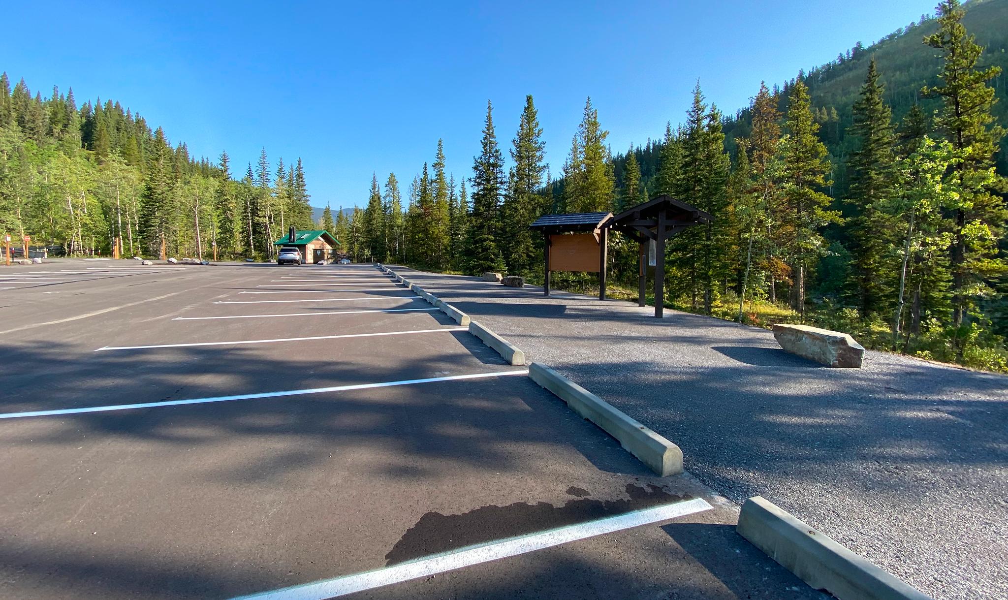 Expanded parking lot with washroom facility and information kiosk at Ing's Mine trailhead in Kananaskis