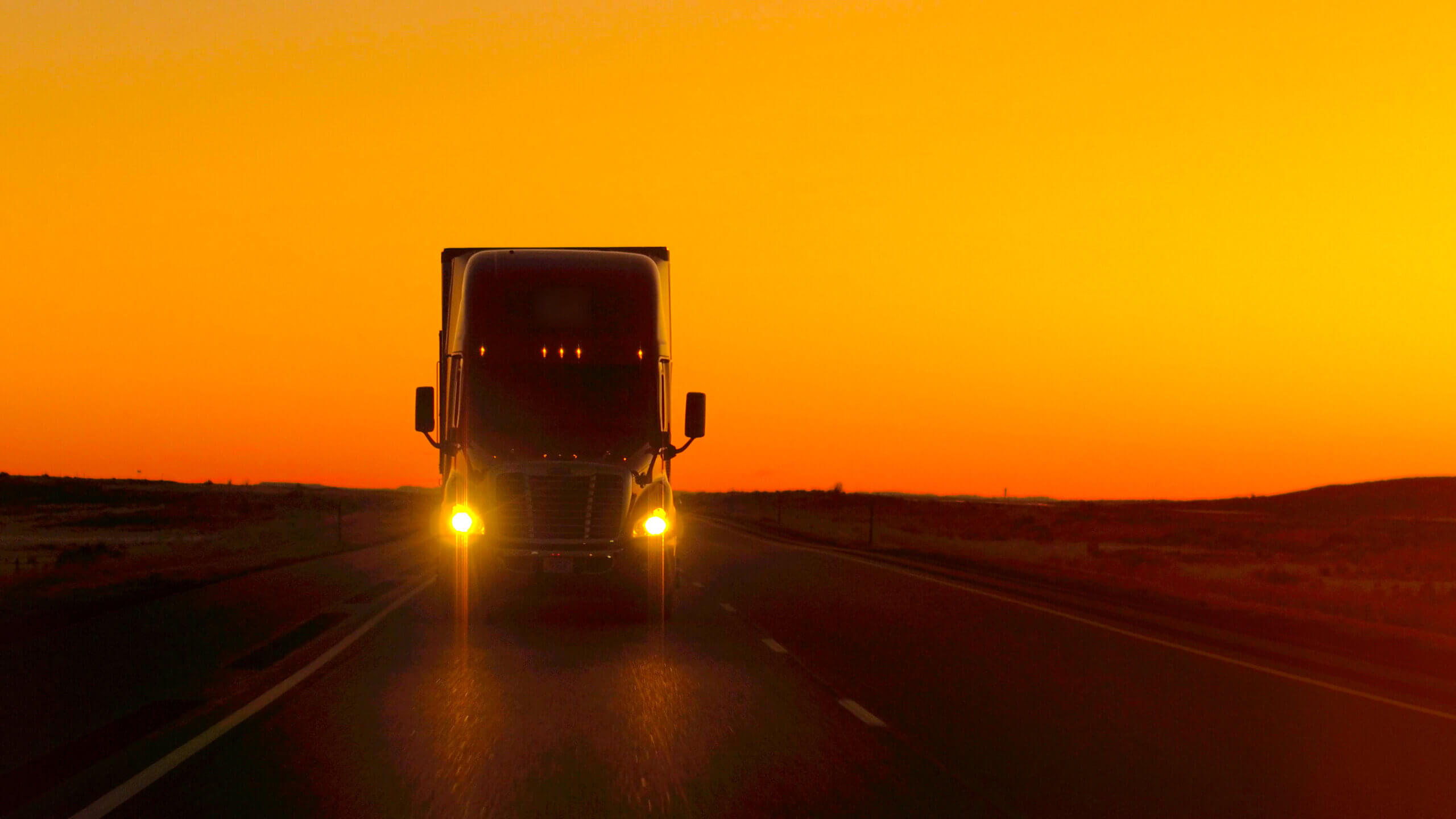 ruck on highway in sunset representing trucking hours under proposed FMCSA regulations