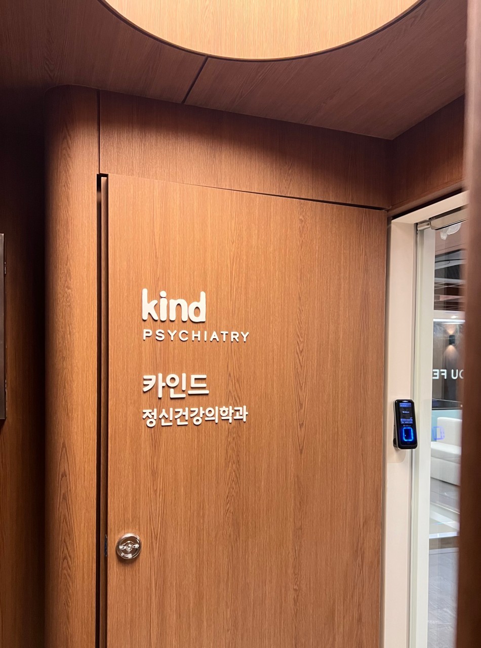 brown wooden coffee table beside sofa