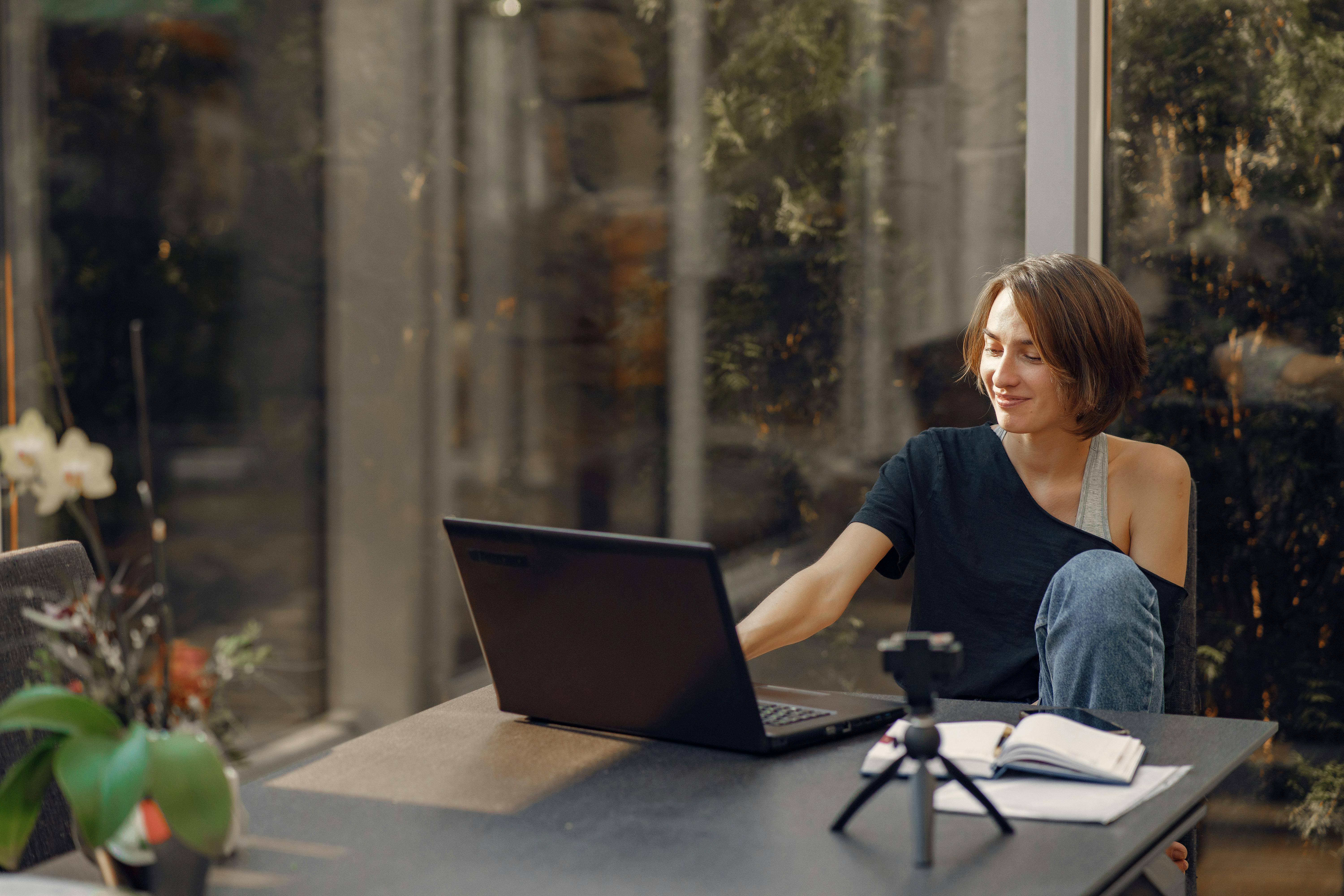 Woman working from home sending cold emails