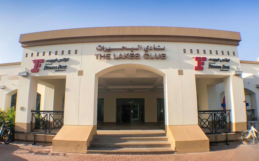 The Lakes club Dubai: modern architecture, surrounding greenery, community hub.