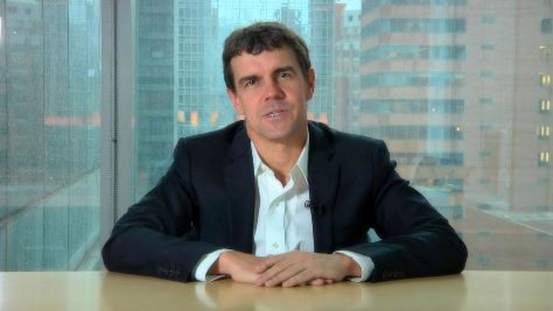 smiling woman wearing white and black pinstriped collared top