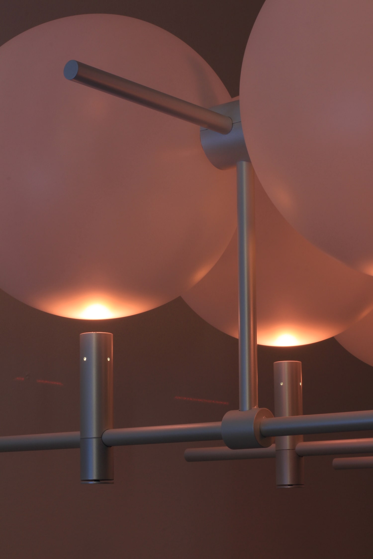 Luna II chandelier structural detail showing linear metal composition and assembly points by Jiri Krejcirik