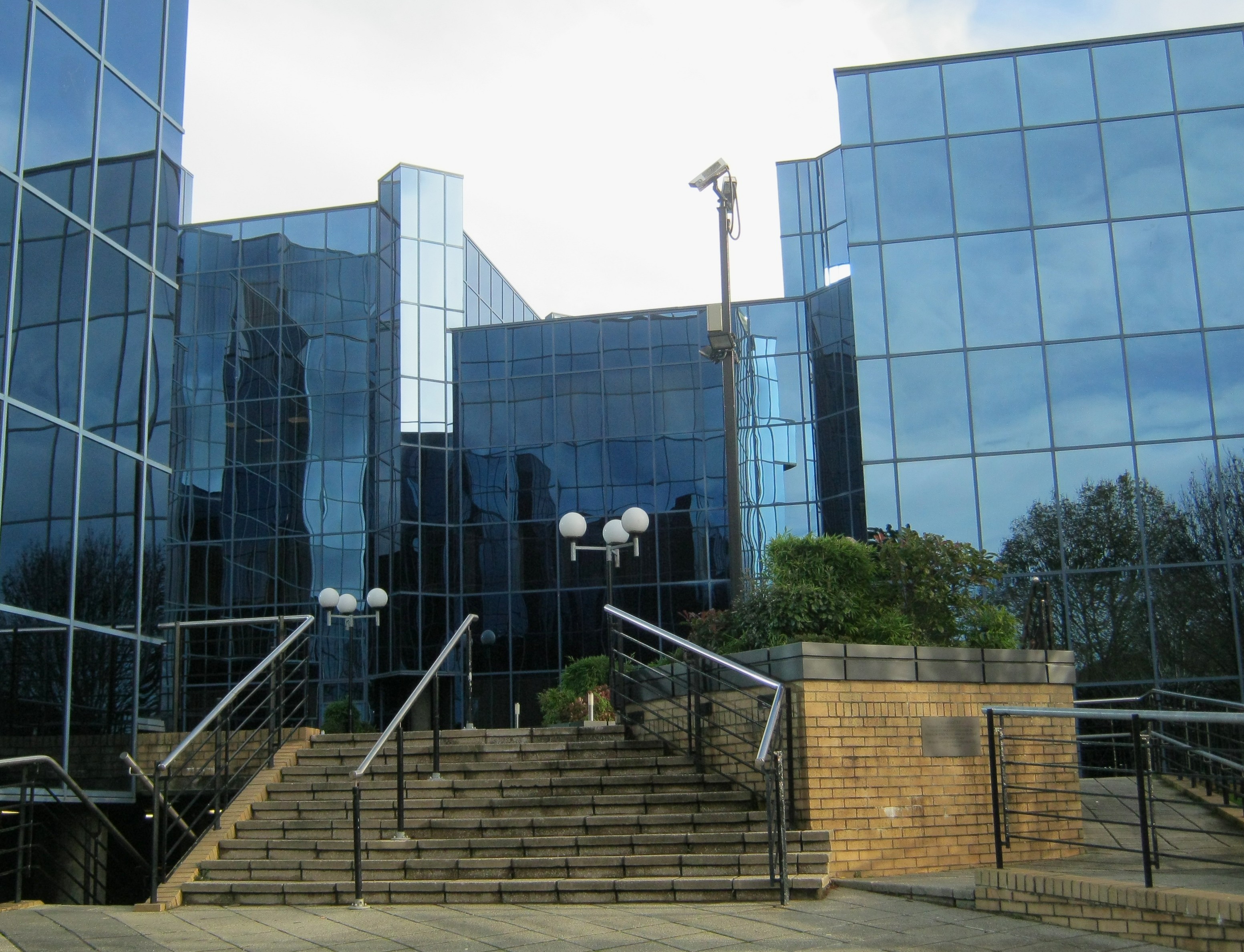 Glazed commercial building entrance representing commercial and developer structural engineering support