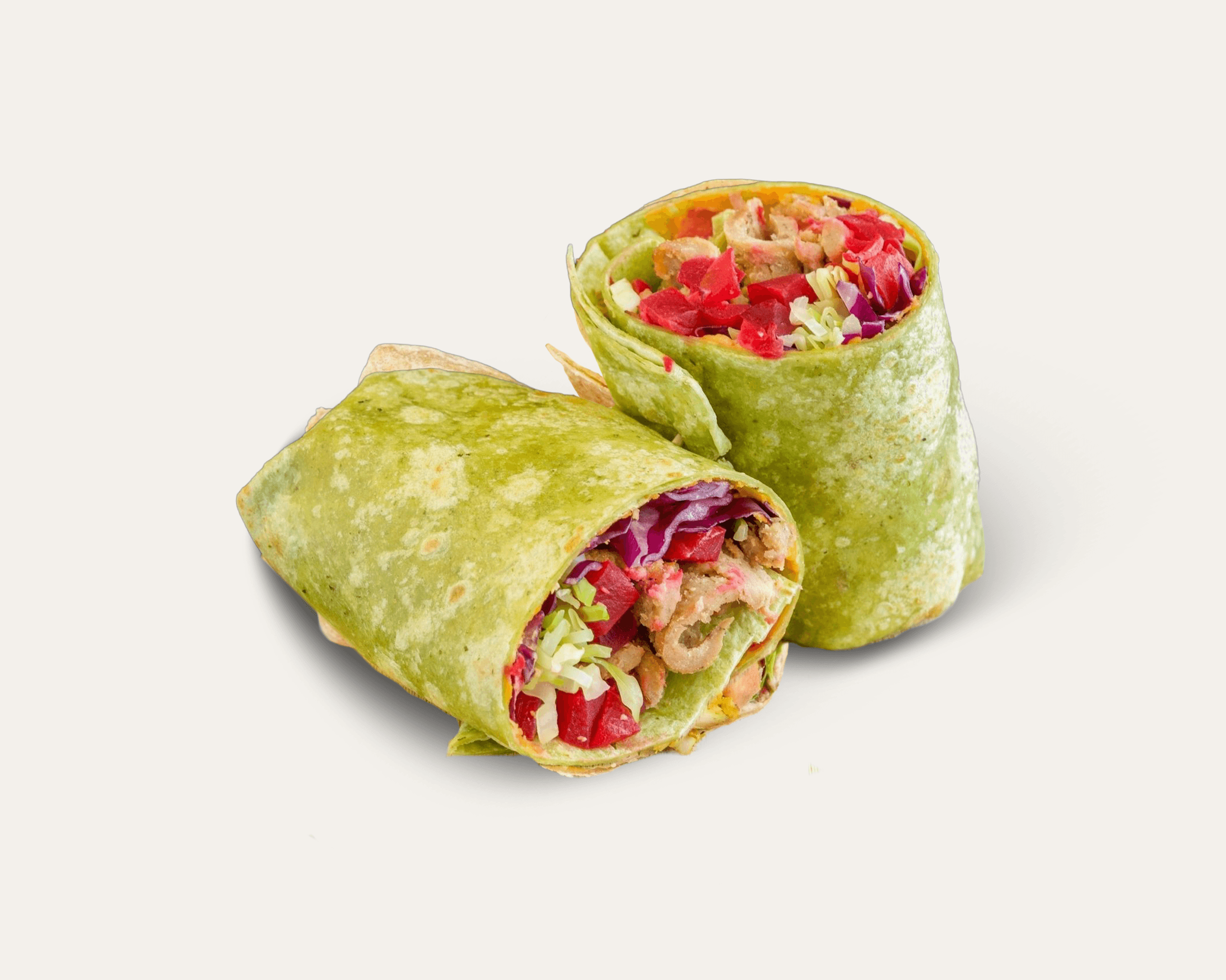 A tightly wrapped Mediterranean tortilla-style wrap featuring fresh vegetables and grilled protein.