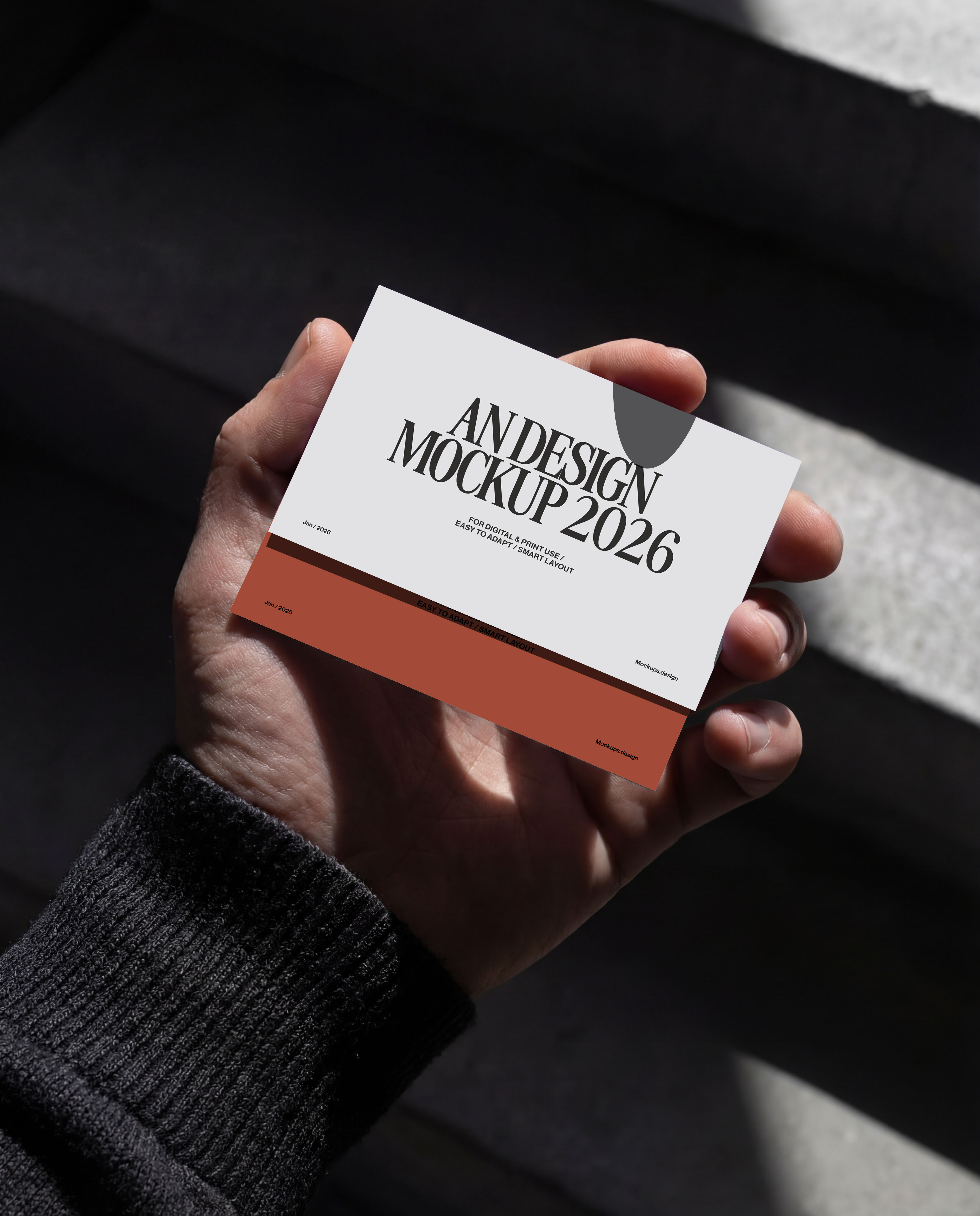 Hand holding business card mockup, clean studio scene