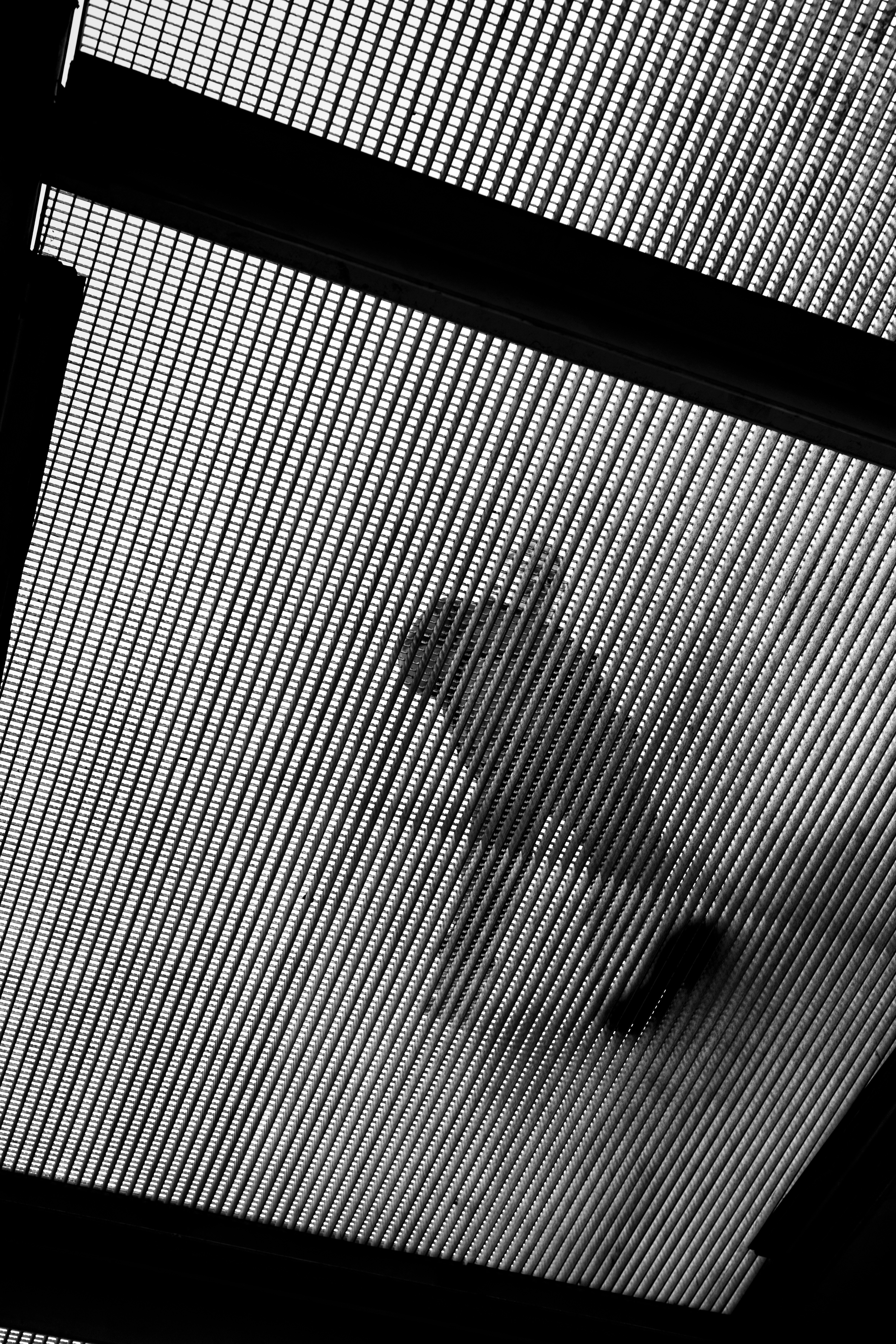 Abstract pattern of light and shadow on mesh