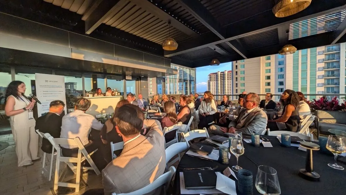 Surgical AI circle event held by uncovr ai with a big group of people in the sun