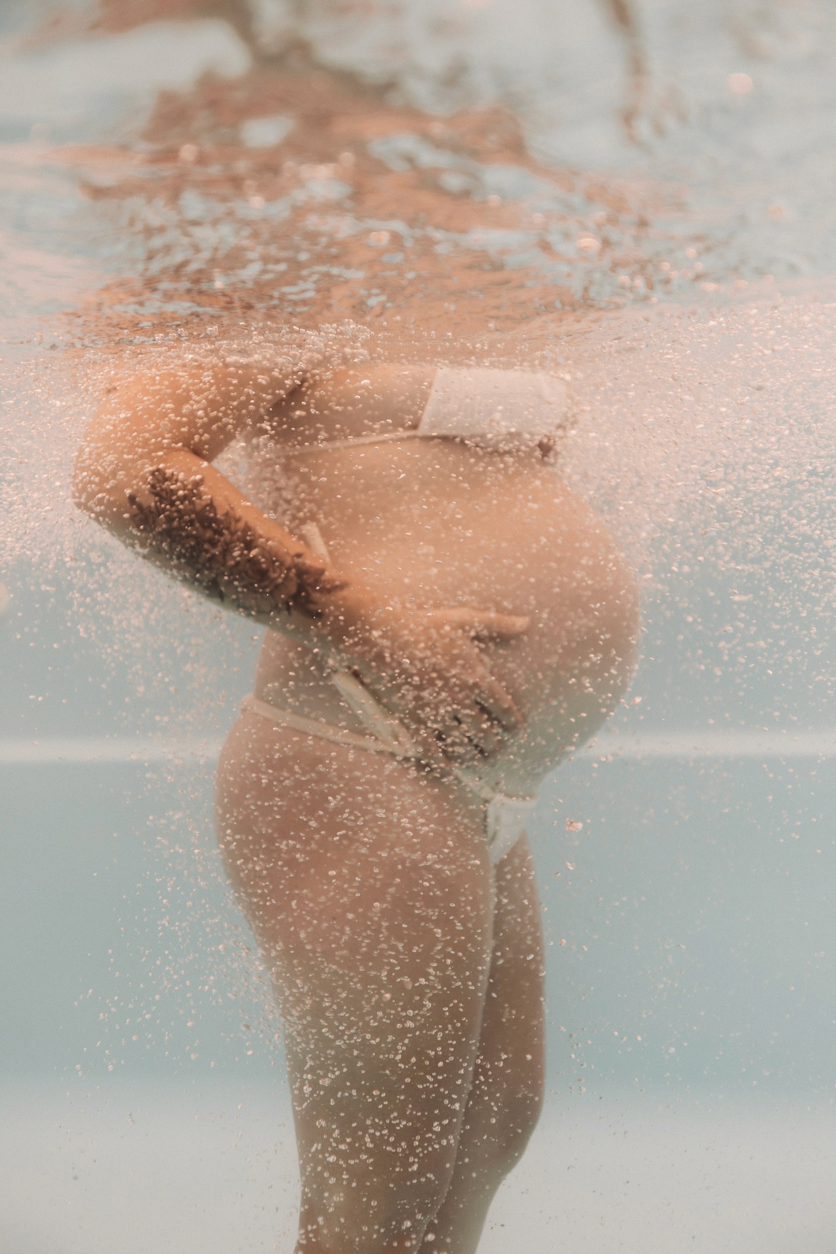 Artistic underwater maternity photography session in Mackay Queensland