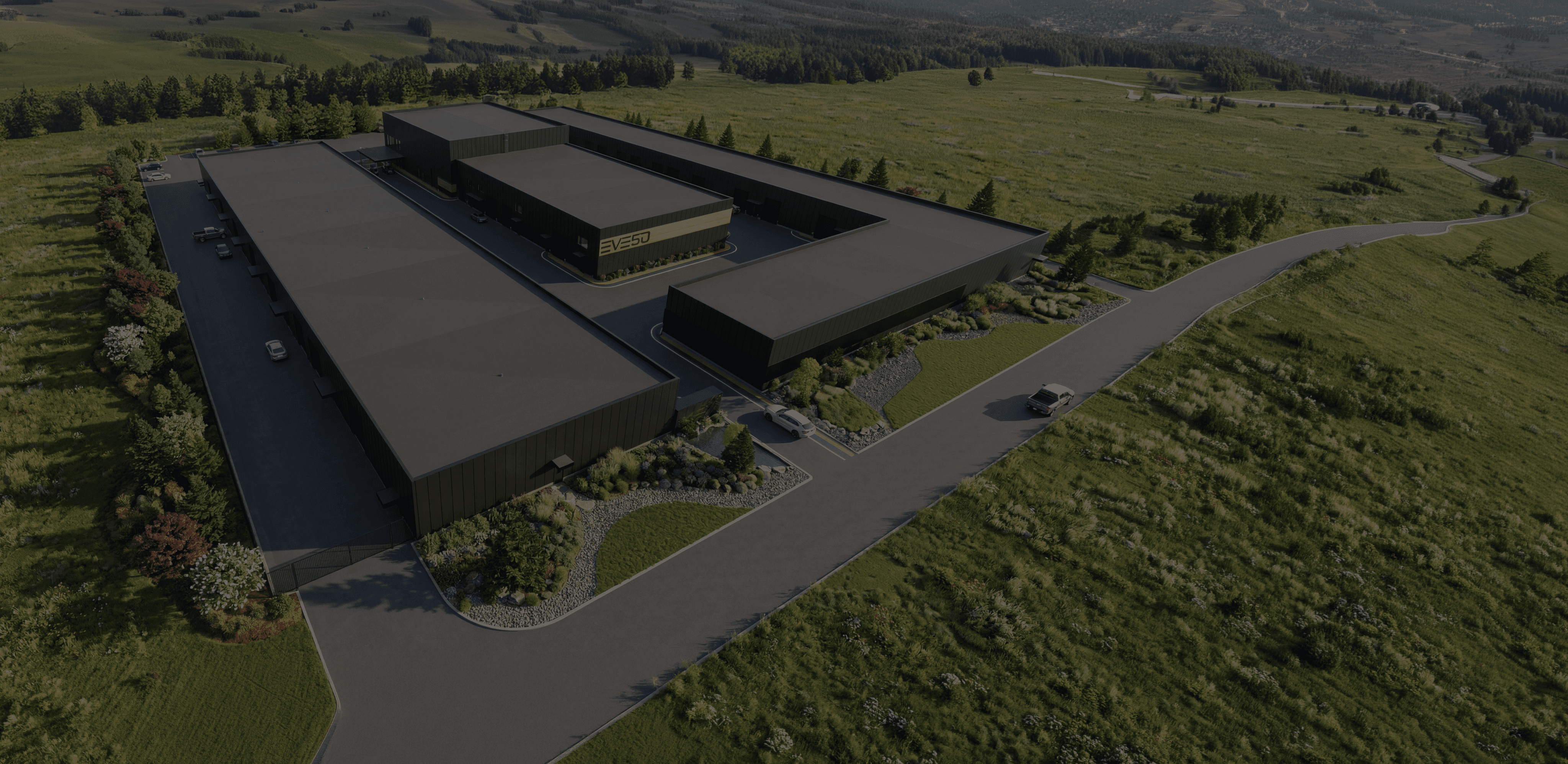 Site aerial view showing the whole site plan for Eveso including buildings, landscaping and entrance with signage