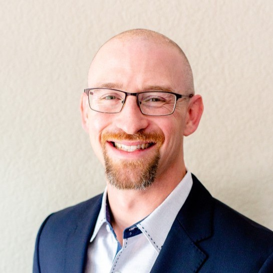 profile photo of a man in neutral lighting