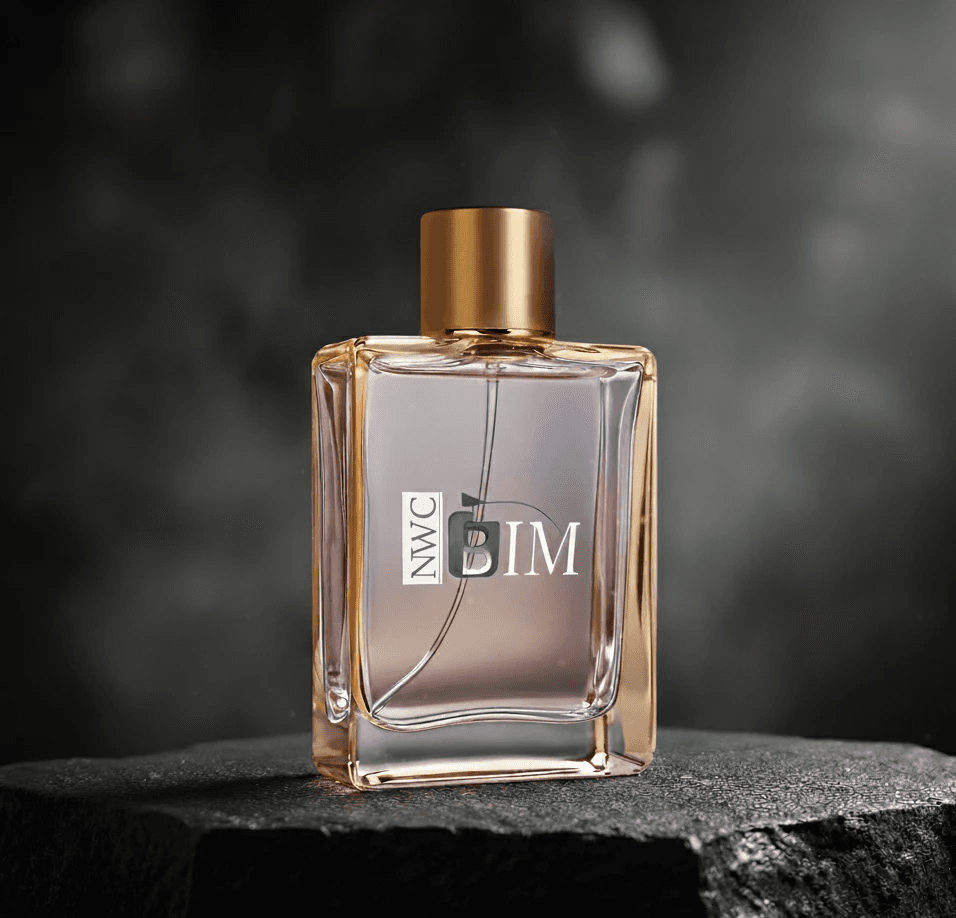 Perfume bottle with a gold cap, and the word "BIM" is written on the glass.