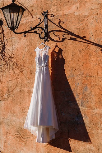 A portrait of a Western woman wearing a hat and sunglasses