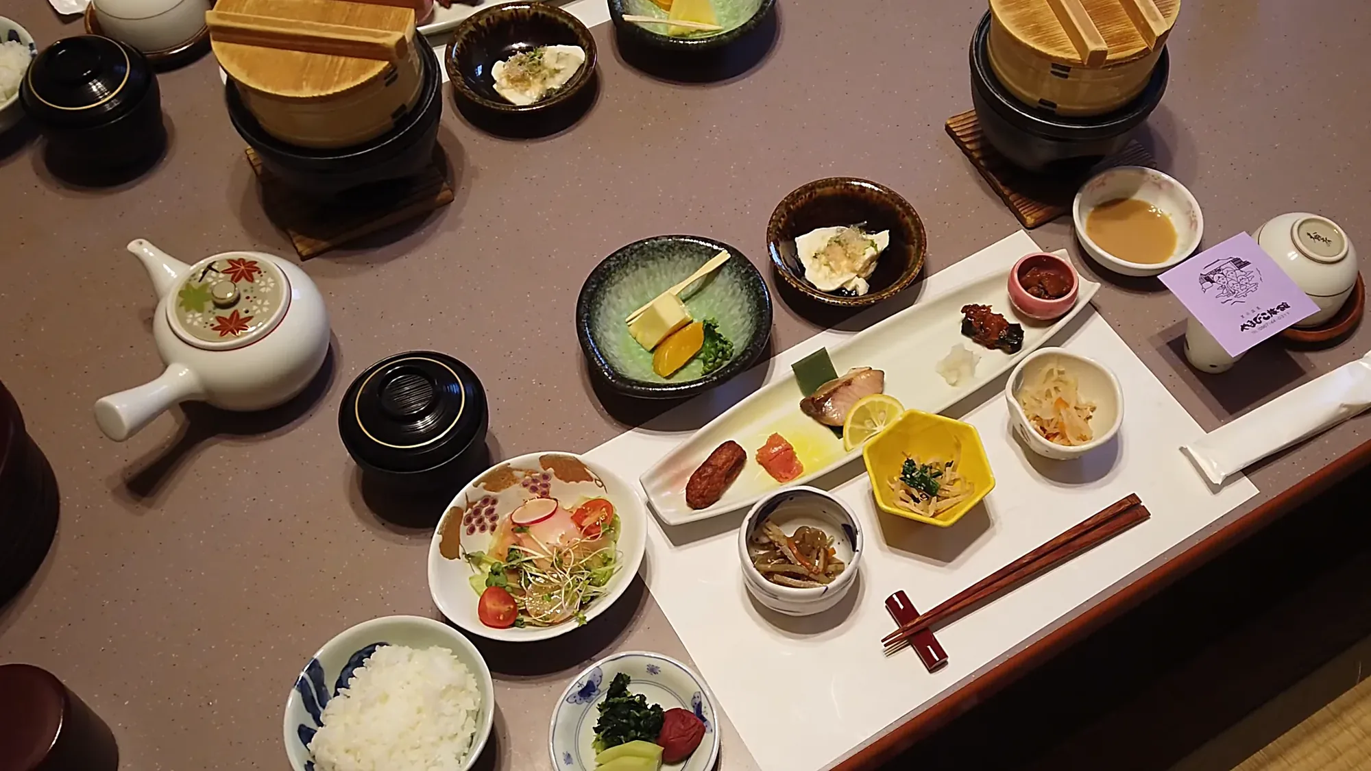 A full kaiseki spread with several courses and individual hotpots