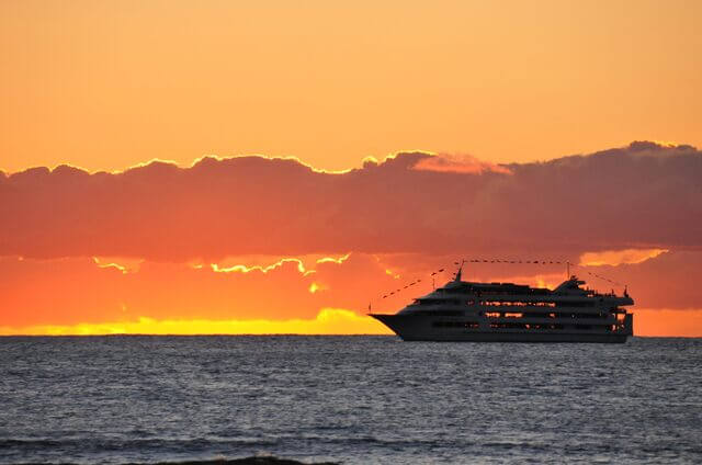 Tropical beach with umbrellas and lounge chairs.