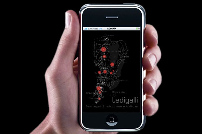 A hand holds a black iPhone displaying a map of Tedigalli on a black background. The map shows red dots scattered across the area. The time displayed at the top is 4:20 PM. The carrier name "Carrier 33" is visible at the top left. The text "Become part of the buzz" is displayed at the bottom right, along with the website address "www.tedigalli.com".