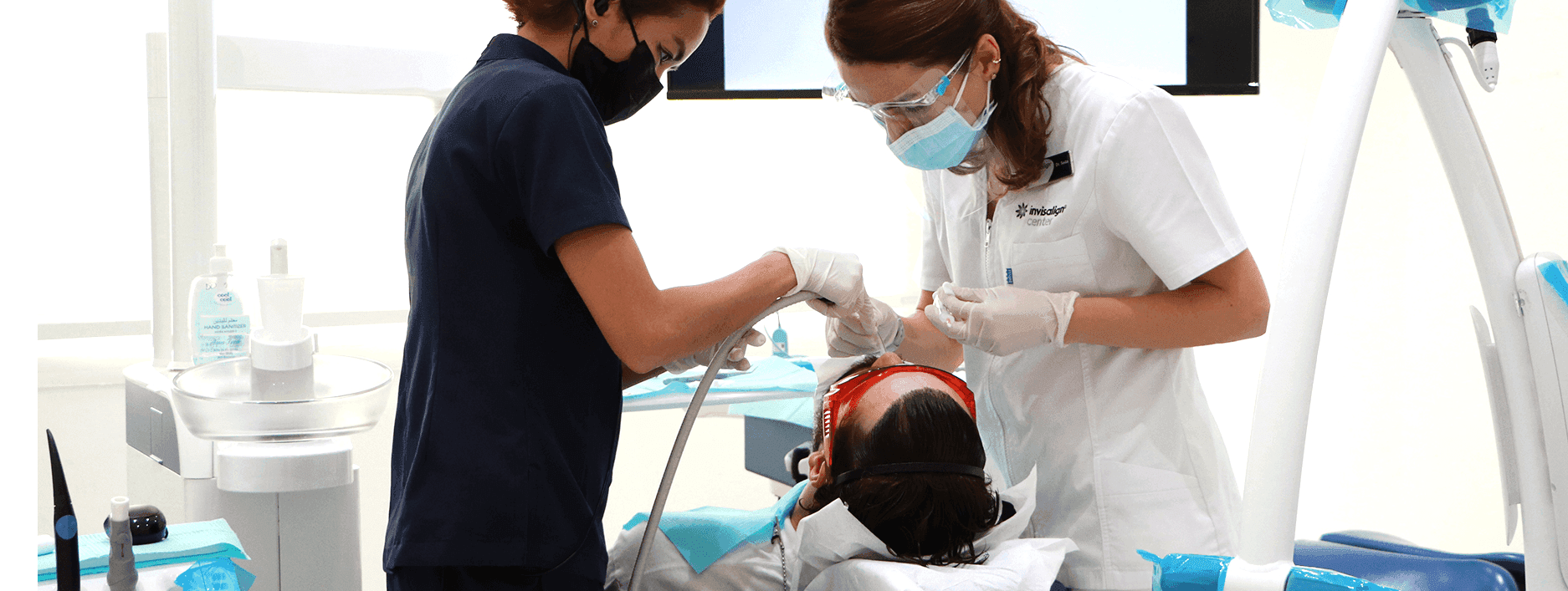 Pediatric dentists in Dubai at Invisalign Center with a child undergoing dental treatment, enjoying gentle, friendly dental care.