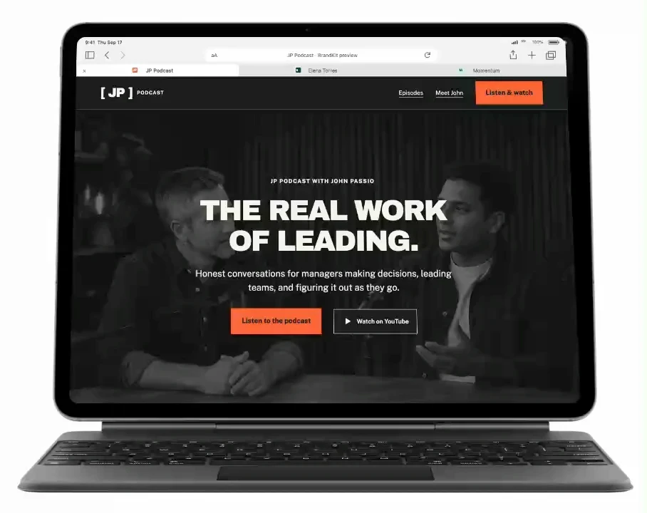 Tablet with Safari showing three fictional BrandKit website concepts