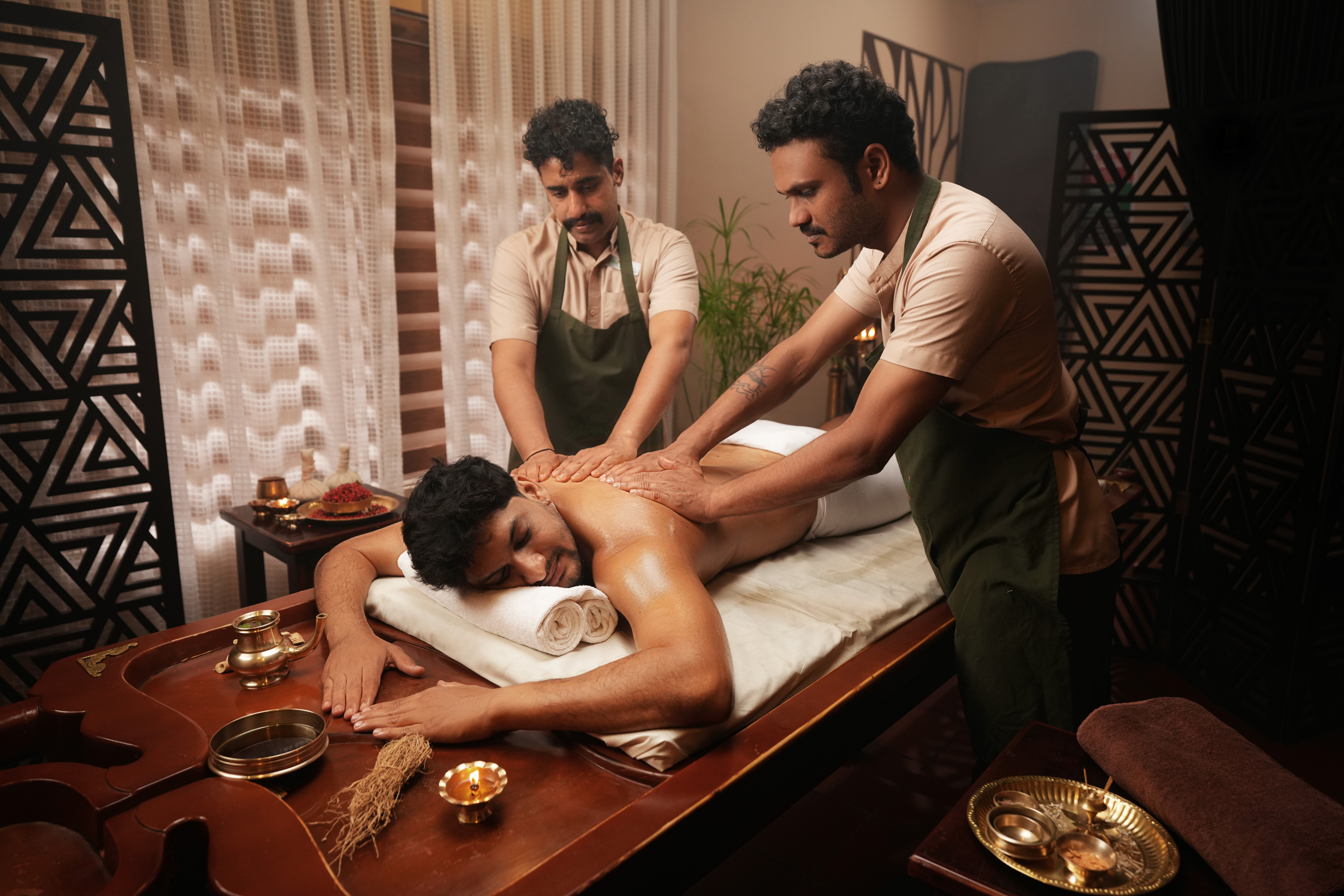Traditional Abhyangam Ayurvedic therapy at AuRevoir Wellness Resort, featuring holistic wellness, herbal oil massage, relaxation, and luxury healing experience in Palakkad, Kerala.