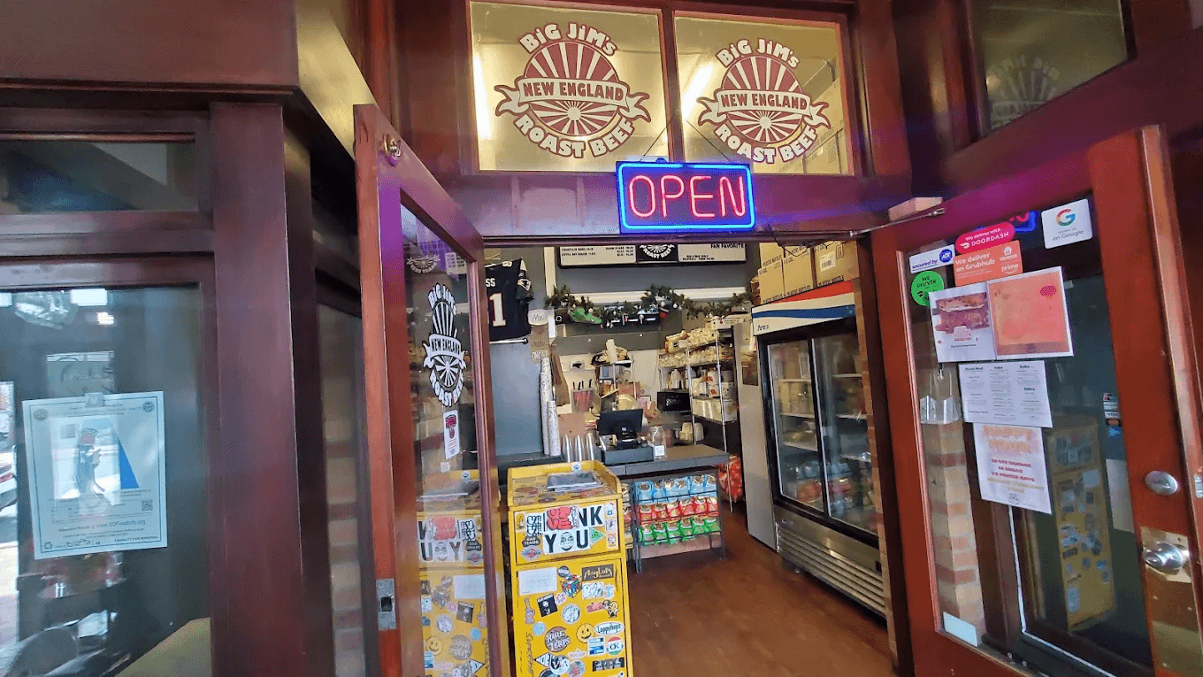 The entrance front door with an open sign of Big Jim's Roast Beef sandwich shop located in Pacific Beach, San Diego