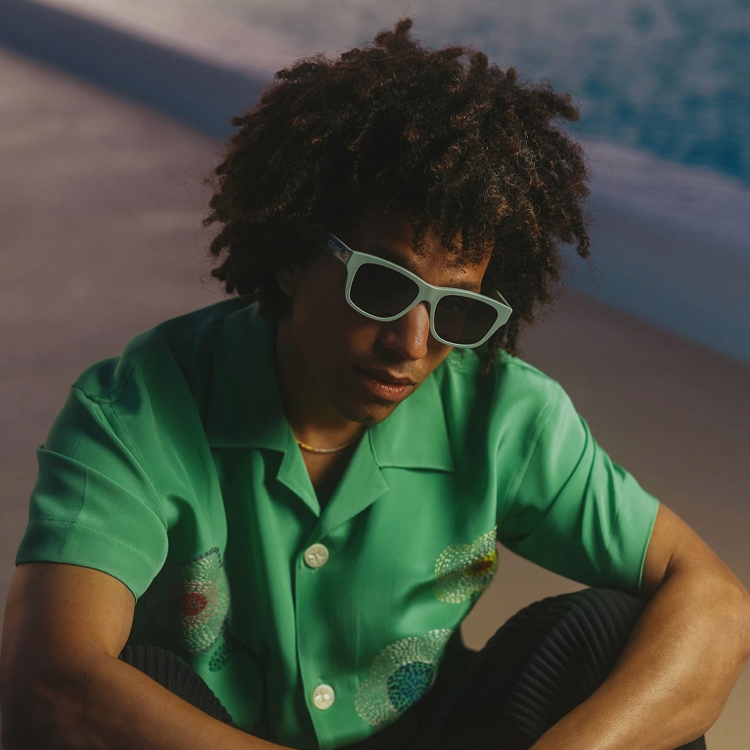 Roark Bailey, music producer for Post Malone, Nicki Minaj, and Drake, with a green-tinted profile photo.