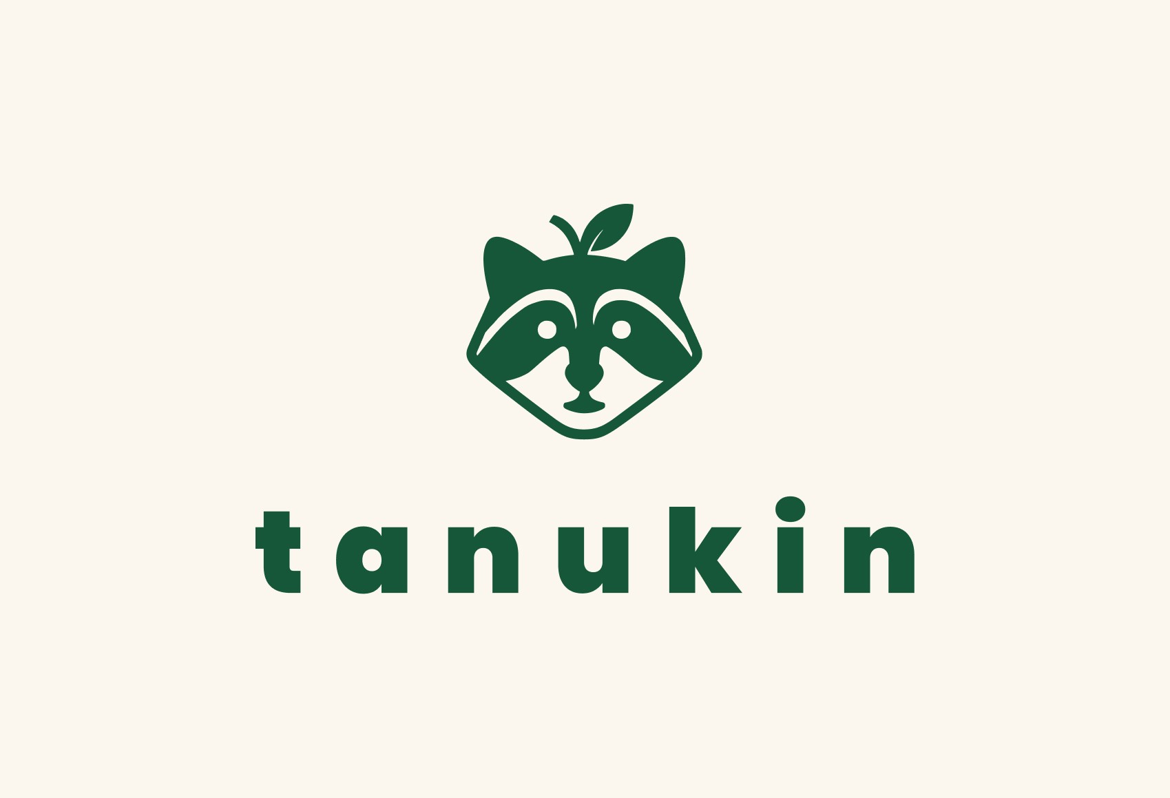 Tanukin Logo. Grün auf beigem Hintergrund.