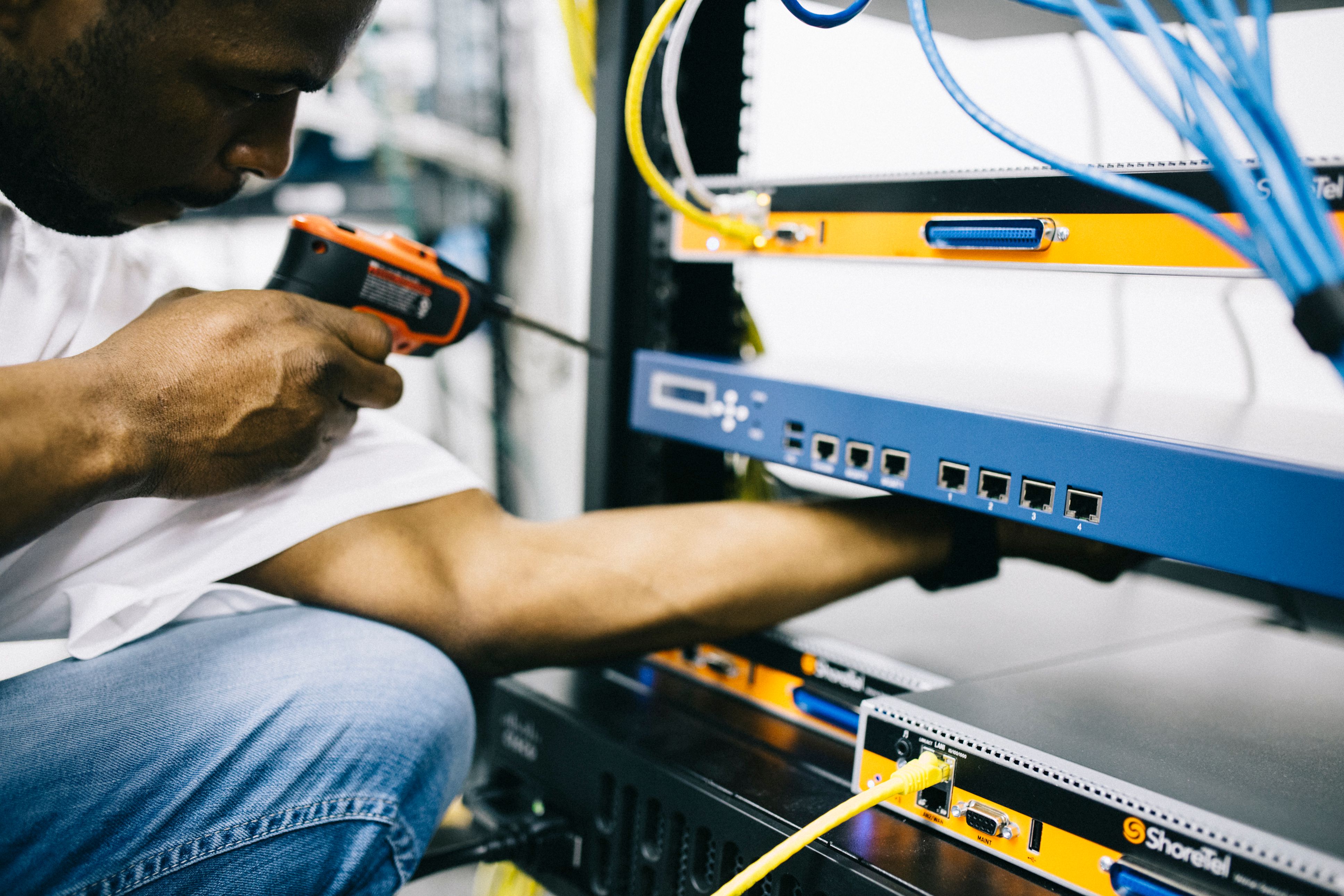 side-view-crop-concentrate-african-american-male-mechanic-in-jeans-and-white-shi - field-engineer (pexels)