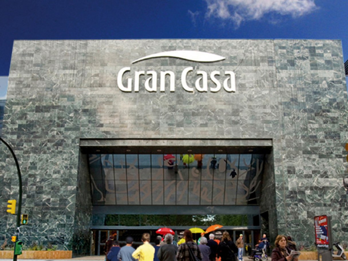 Rooftops of a coastal town with the sea in background