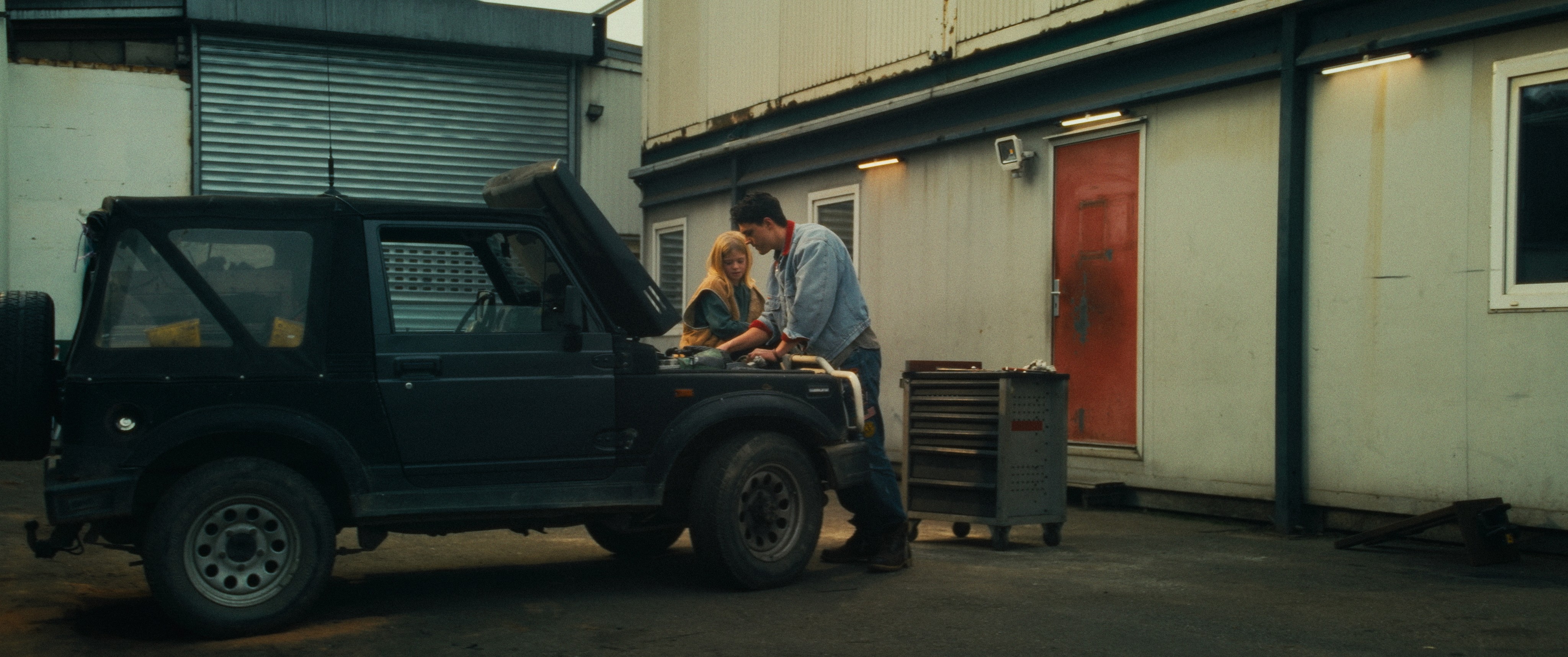 Streetside billboard with flyposters of the Batch.Works brand and illustrations