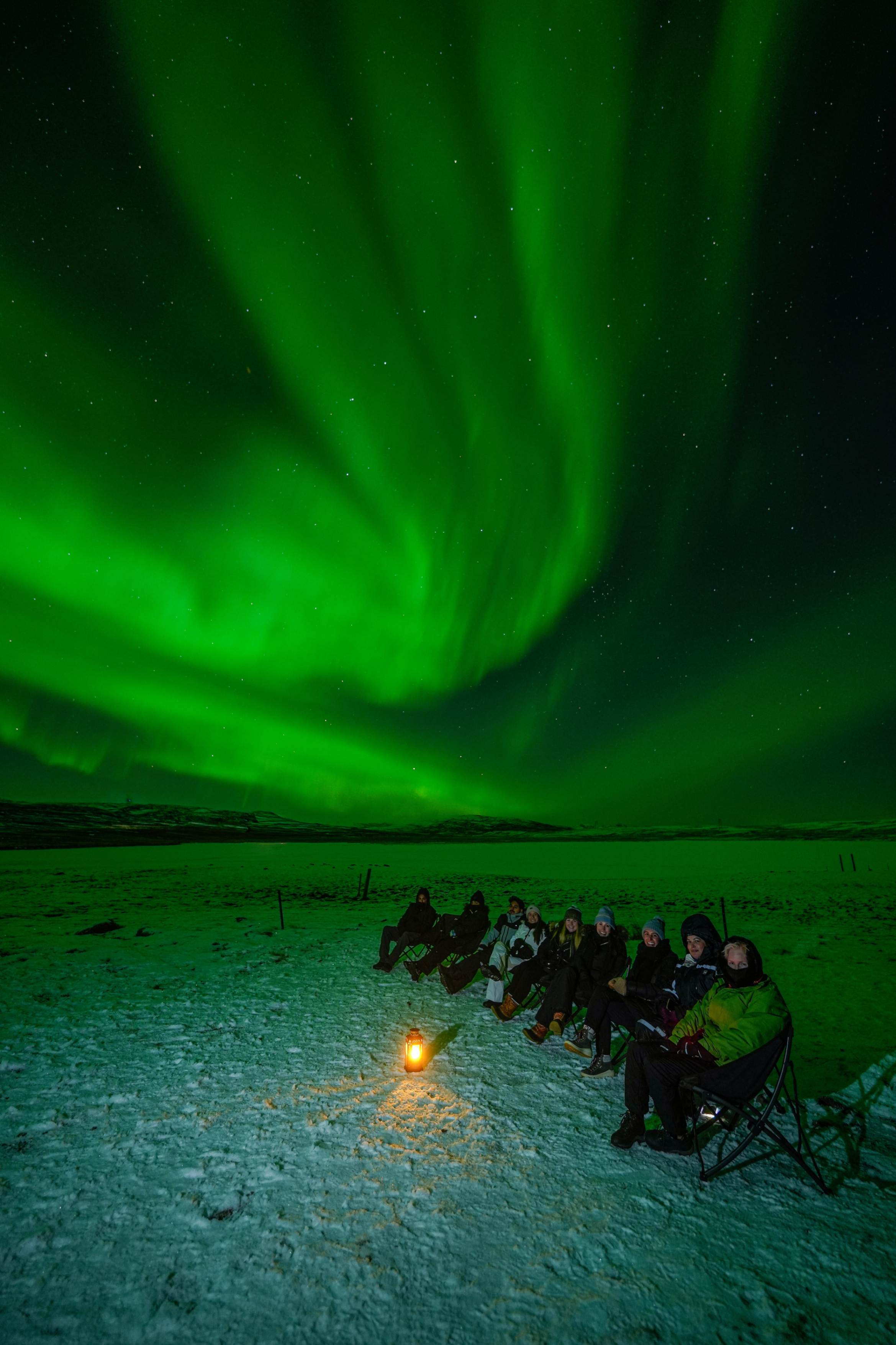 Northern Lights tour photography from Aurora Experts in Iceland, featuring guests beneath the aurora, winter landscapes, and vivid skies over remote Icelandic locations.