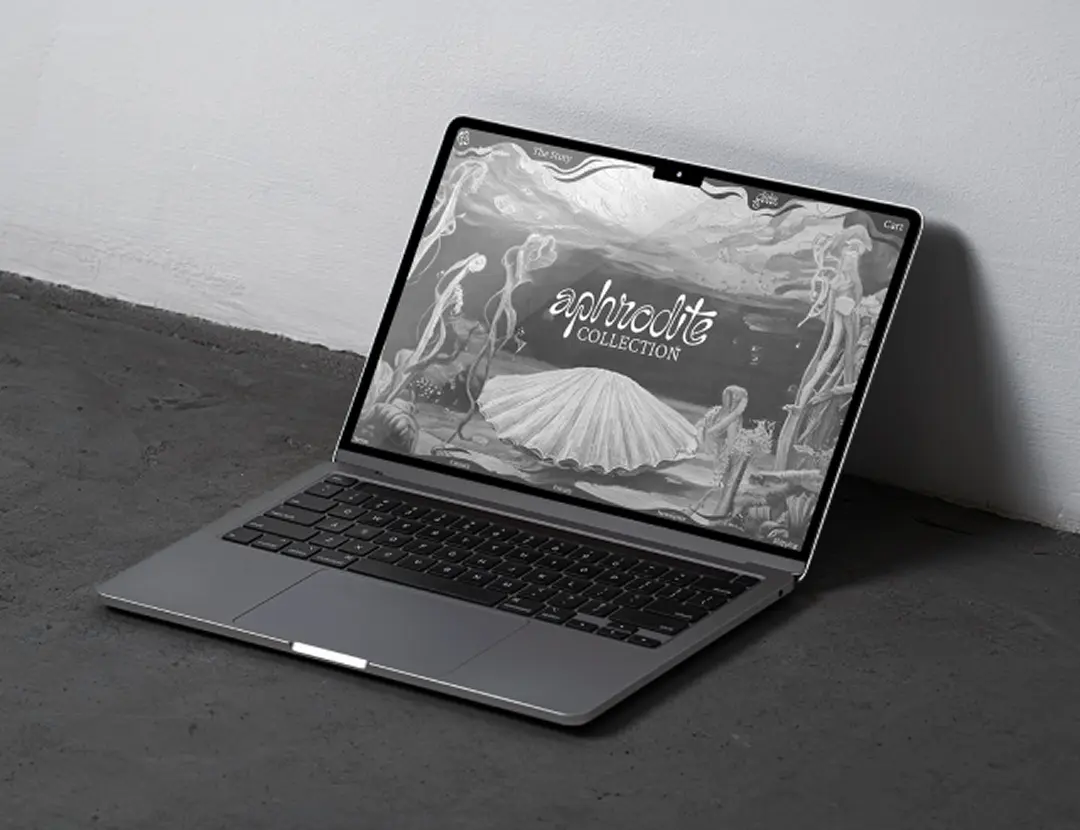 Gaia website mockup — laptop showing Aphrodite collection landing page, web design for jewelry brand