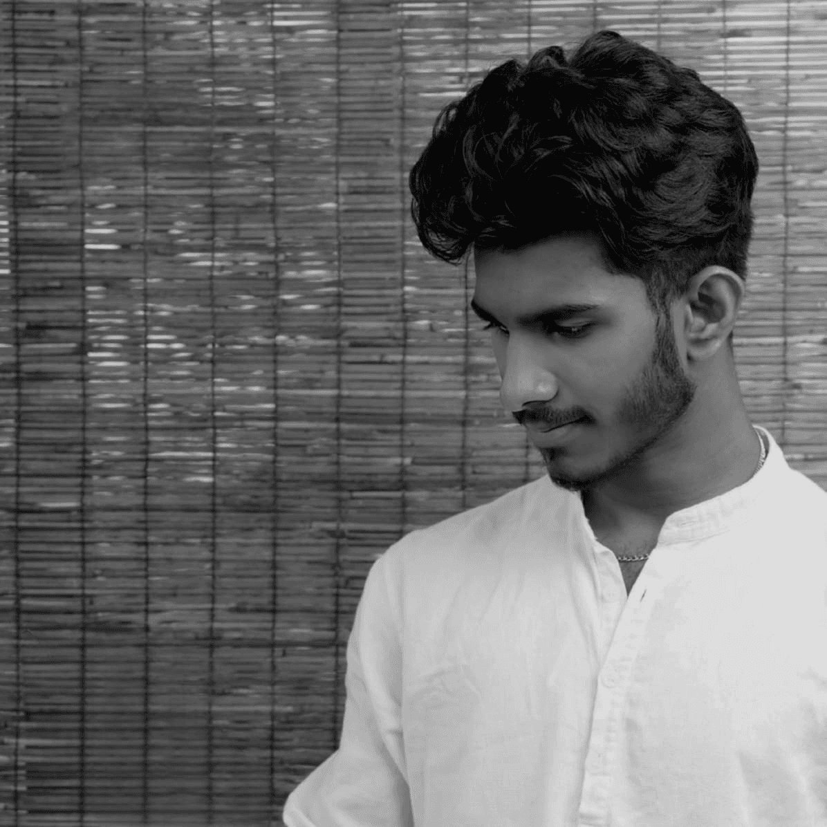 a blurry photo of a person standing in front of a wall