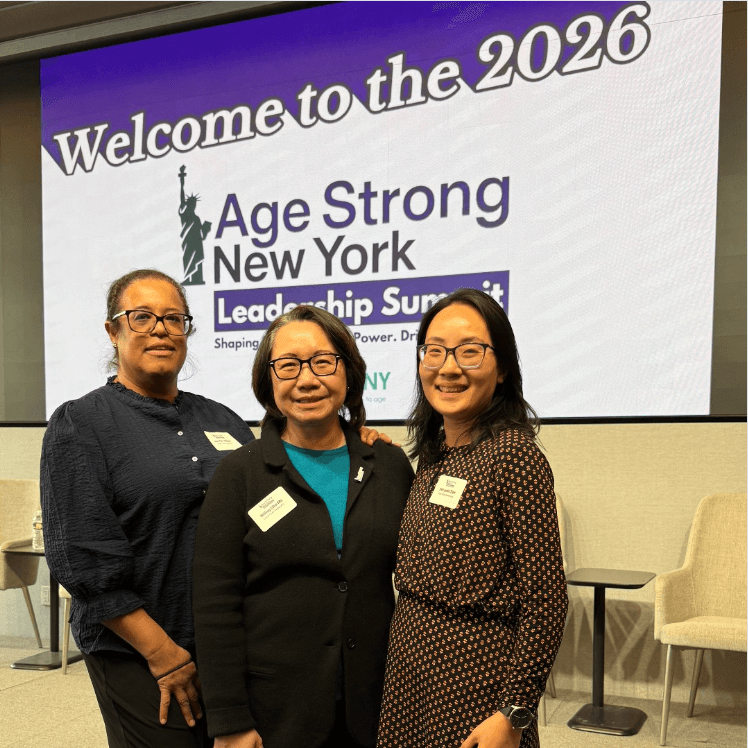 Grand Street staff pose in front of the Welcome to the 2026 Age Strong New York Leadership summit.