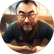 Elderly man with glasses and beard in overalls.