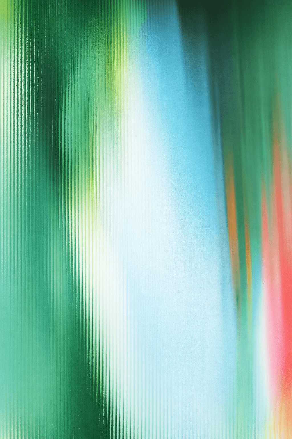 woman holding a phone and man looking at the phone. both are smiling