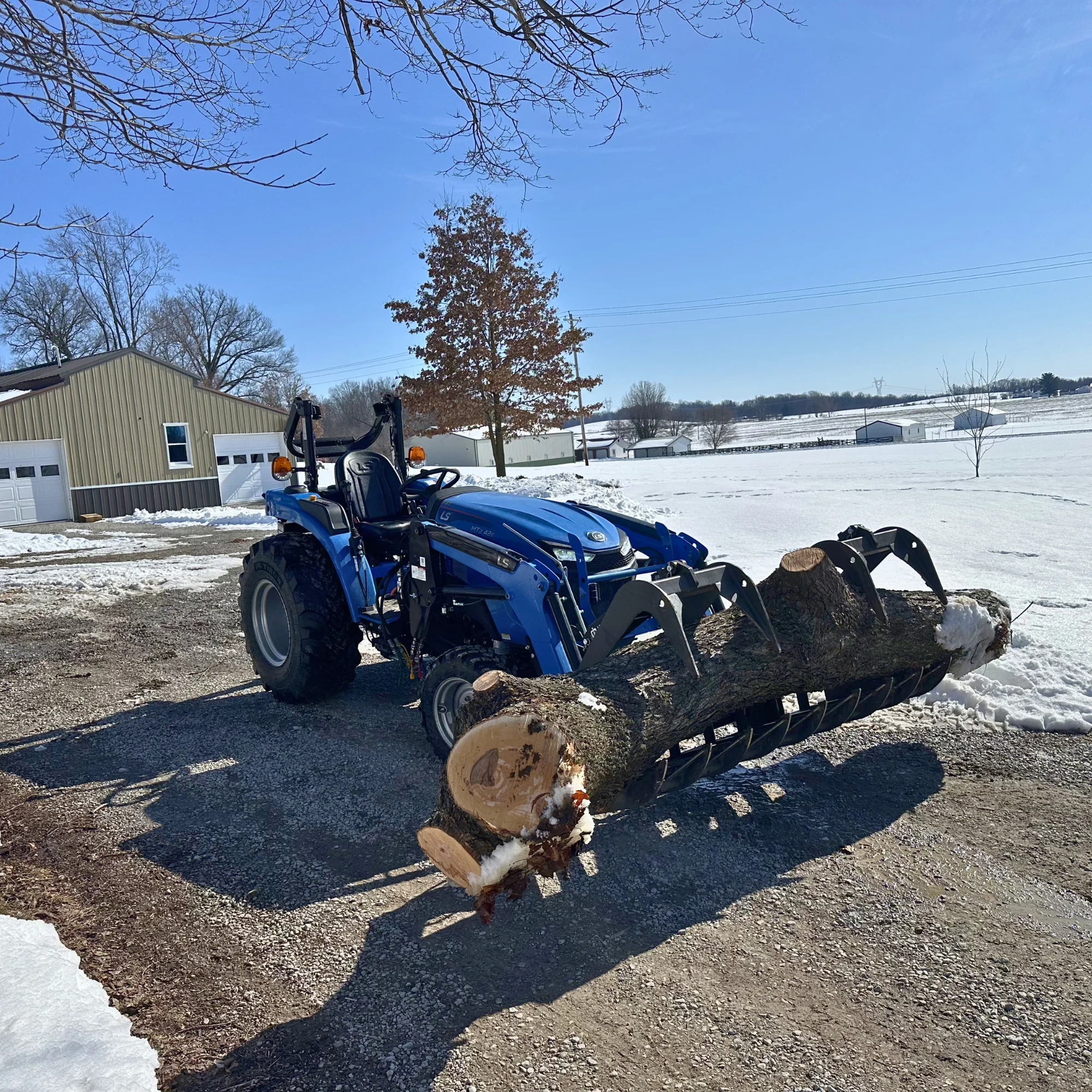 white and black utility truck on brown field during daytime