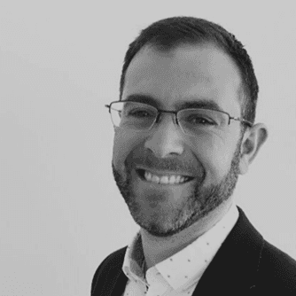 A professional headshot of a man