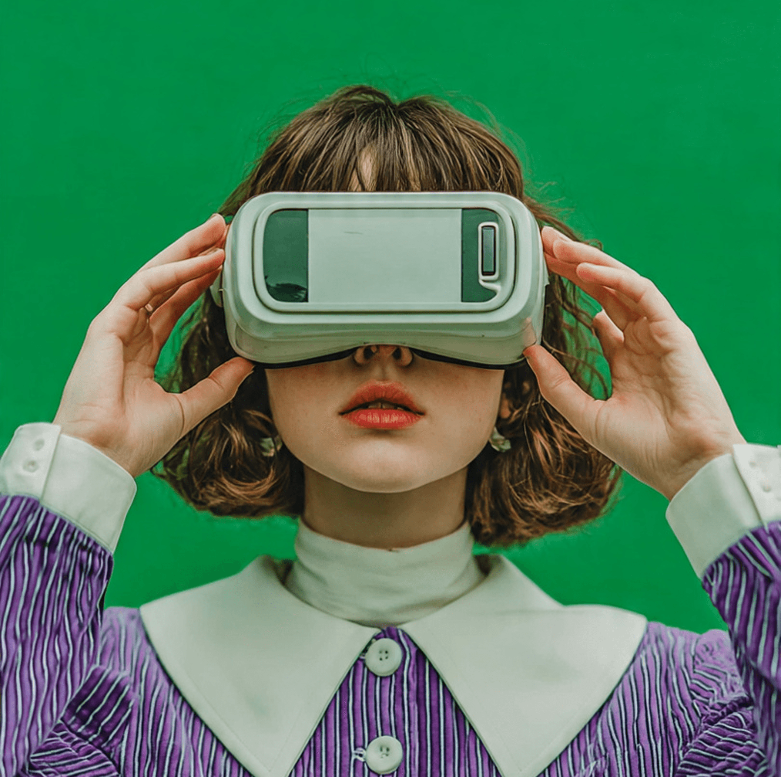 Young leady in green sweater asks a question into a conference mic.