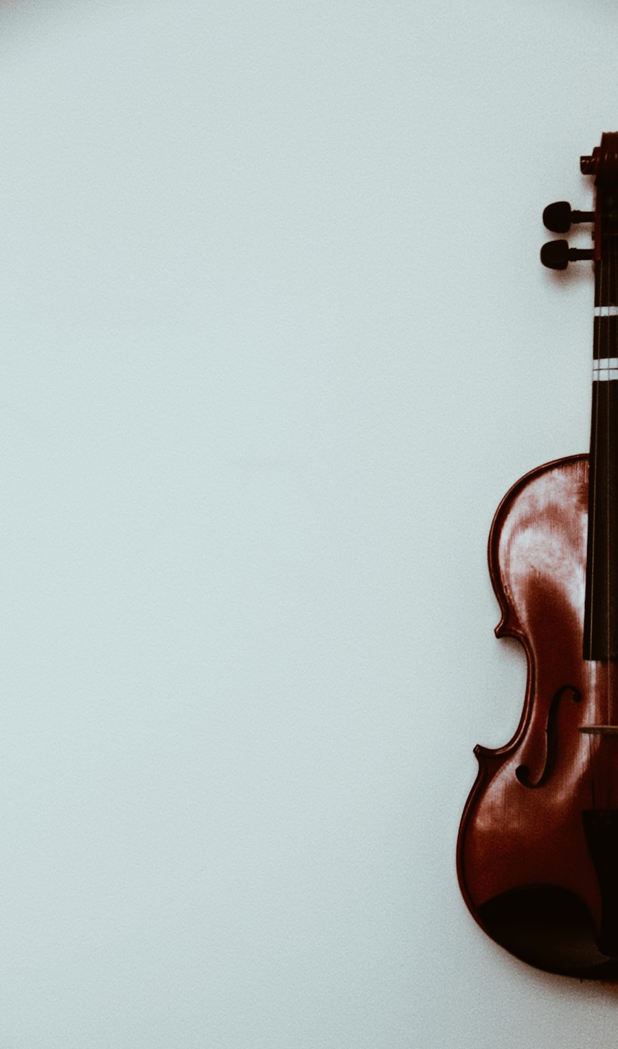 Violin against a pastel blue wall