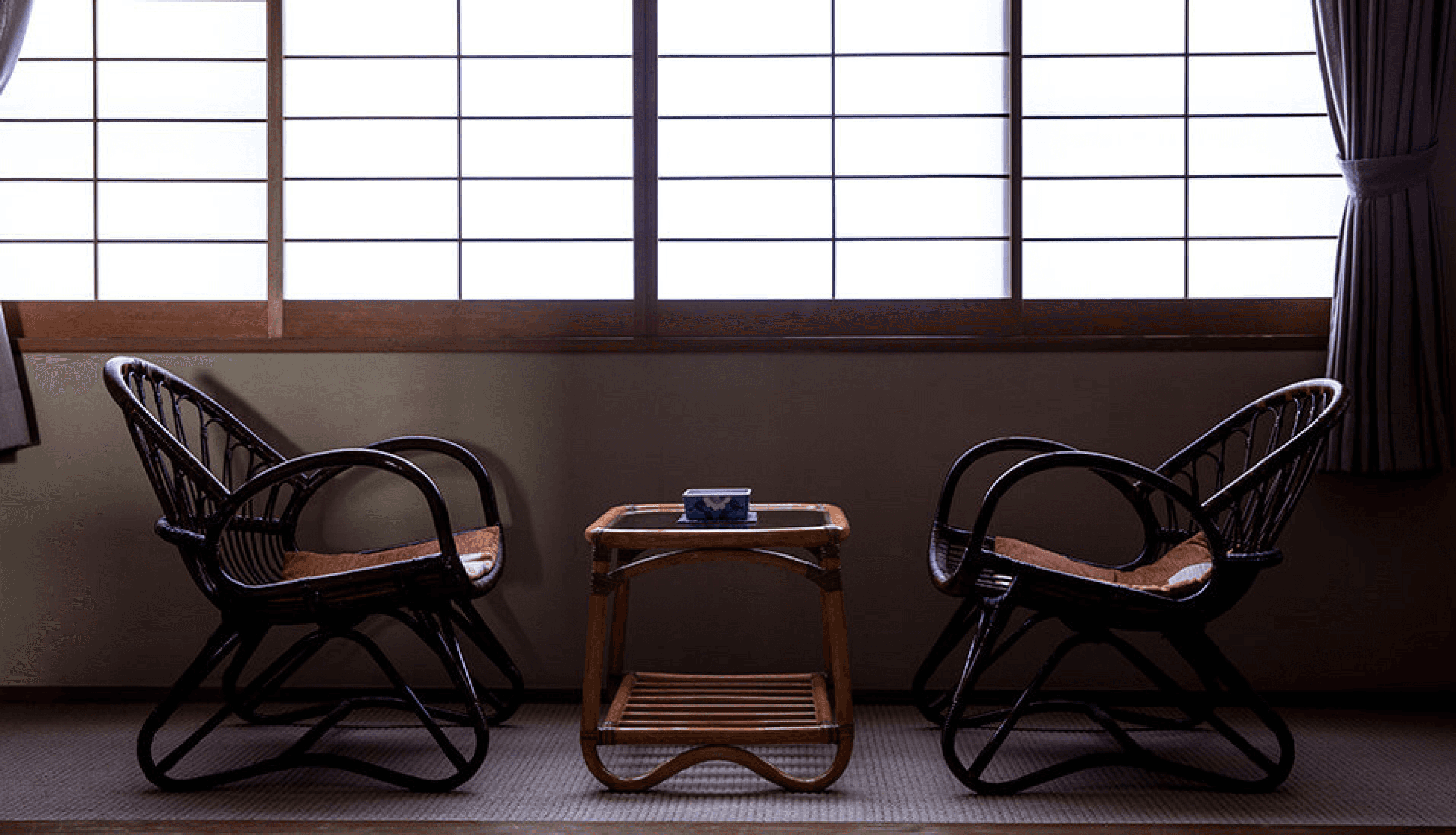 A table on a tatami mat next to a window