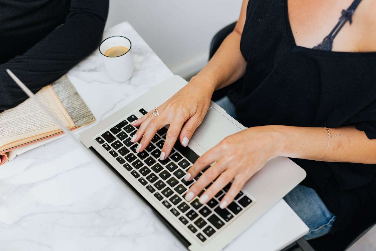 Two palm trees against a clear blue sky