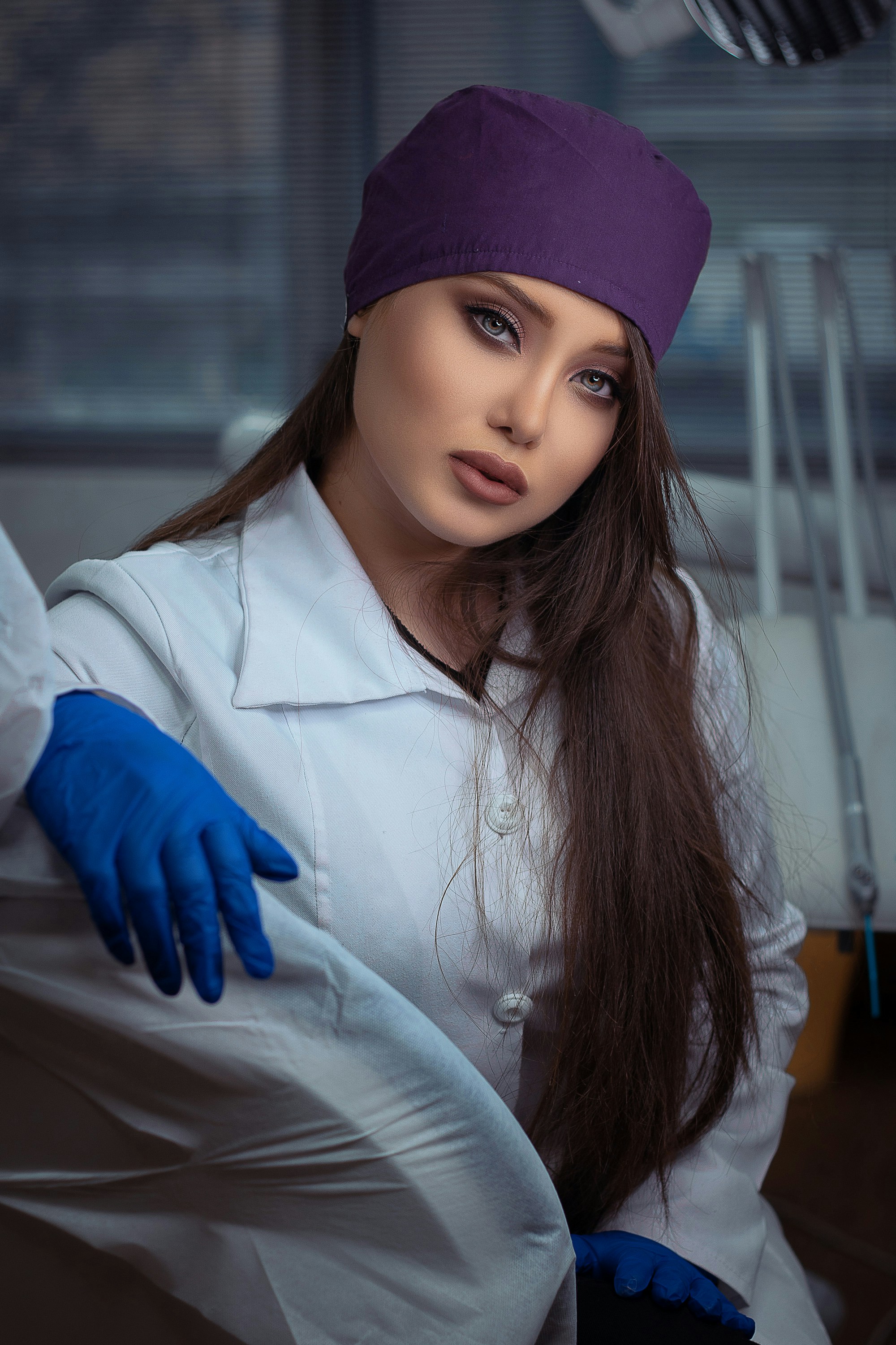 Portrait of Camila Arceo in a white coat and gloves