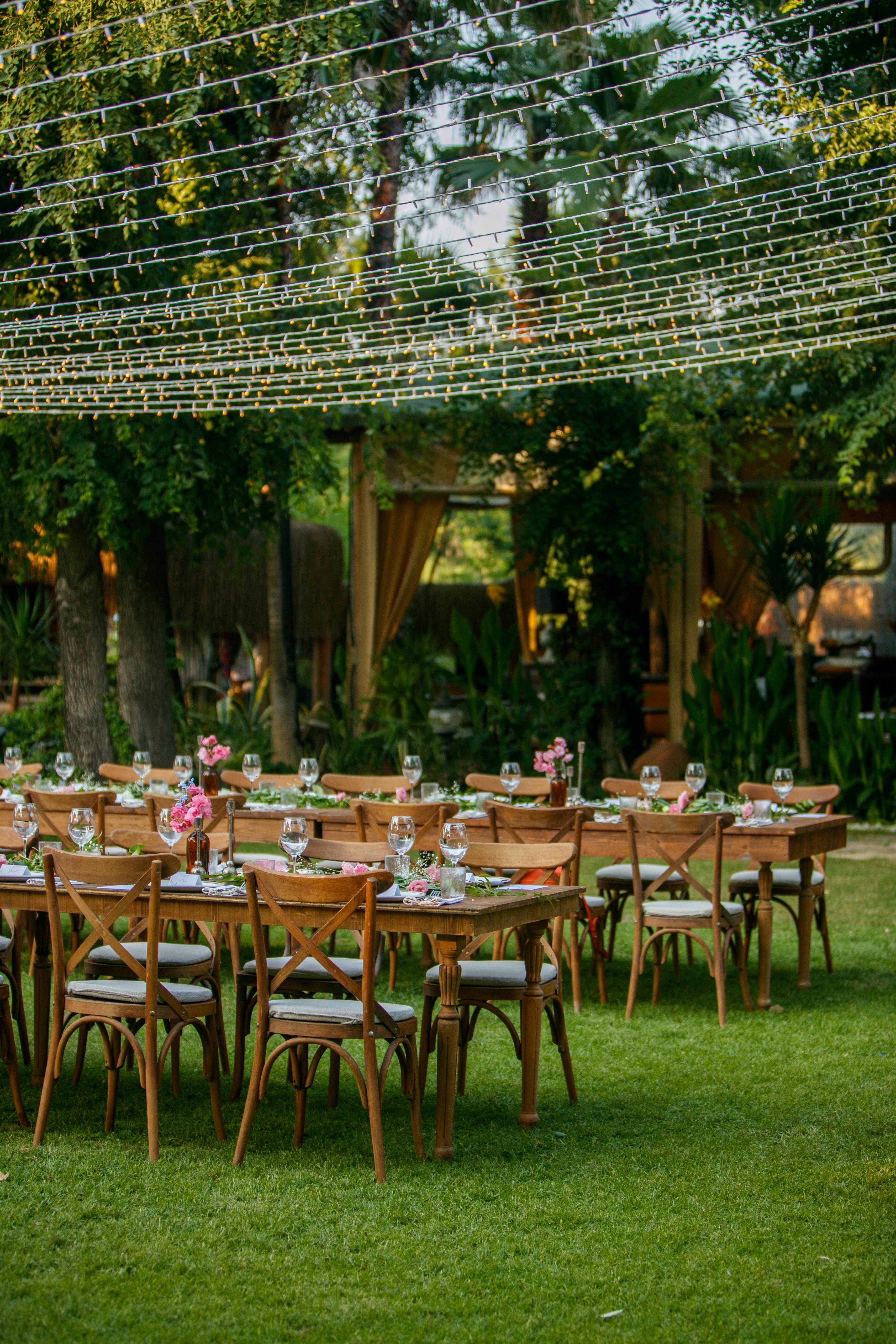 The wedding backdrop is the open sea, shimmering under late afternoon light