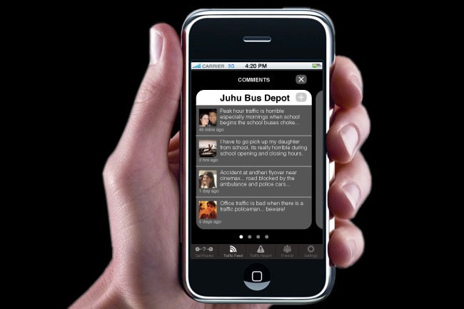 A hand holds a black iPhone displaying a text message conversation. The top of the screen shows "CARRIER 33" and "4:20 PM." The message reads: "Juhu Bus Depot," "Peak hour traffic is horrible especially mornings when school begins the school buses choo...", "I have to go pick up my daughter from school opening and closing hour.", "Accident at andherfly flyover near cinemax... road blocked by the ambulance and police cars...", "Office traffic is bad when there is a traffic policeman... beware!" The bottom of the screen shows standard iPhone navigation buttons.