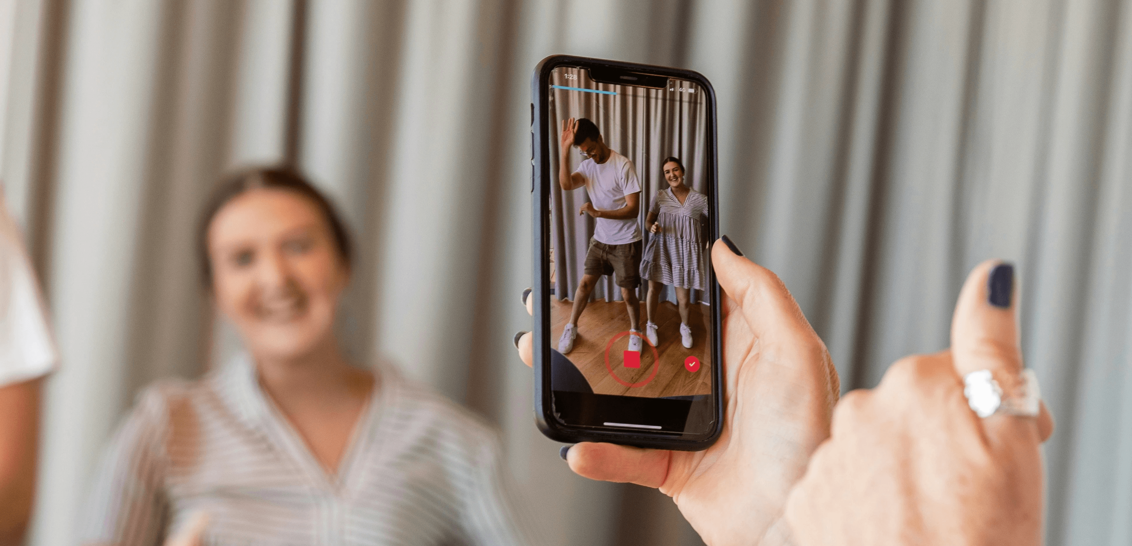 a woman holding a picture of a man