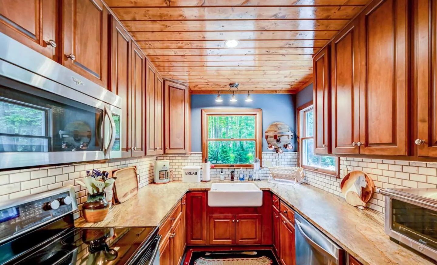 Kitchen with cherry cabinets, butcher block counters and farmhouse sink at Mountain MAMA
