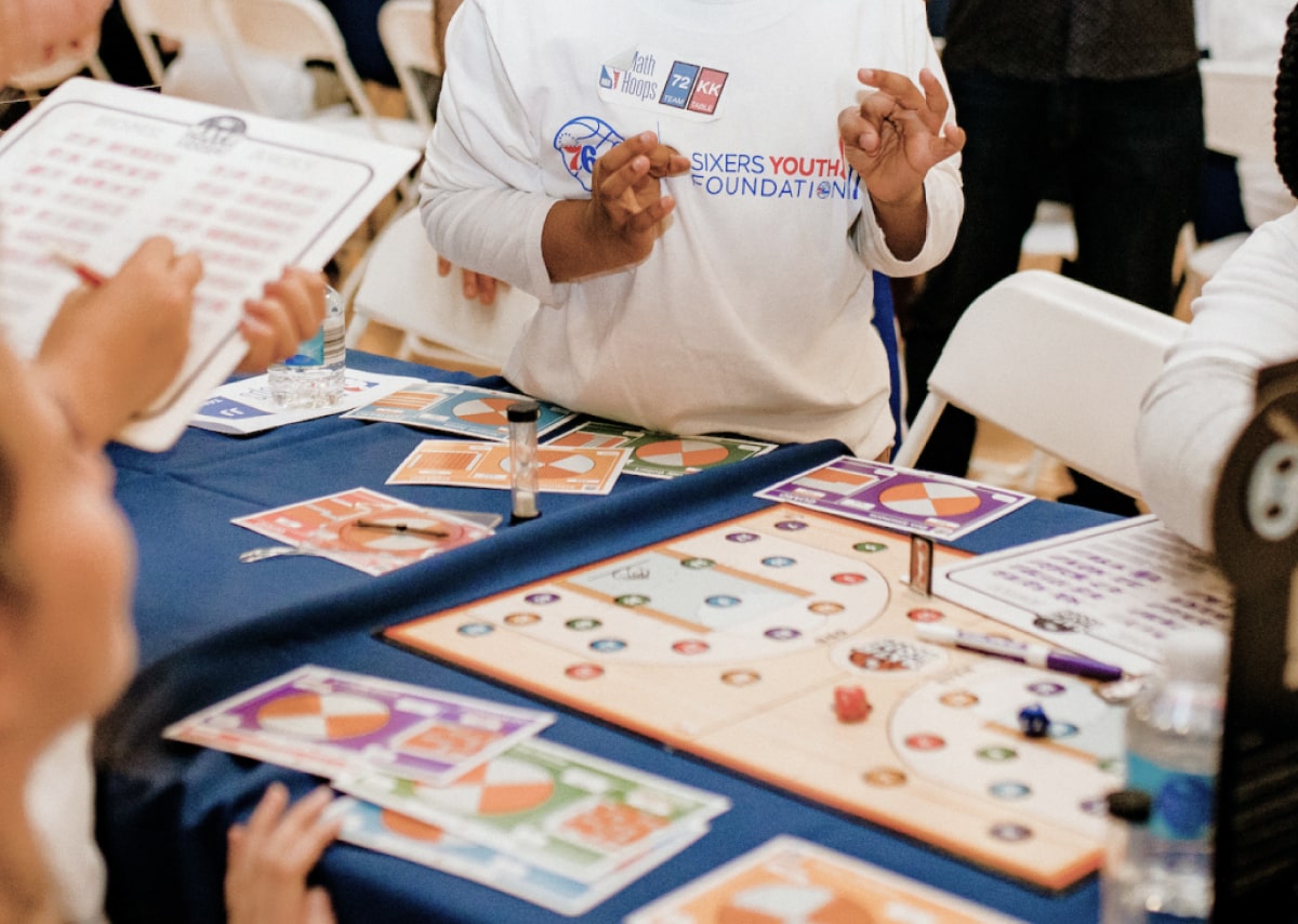 Kids playing NBA Math Hoops board game 2