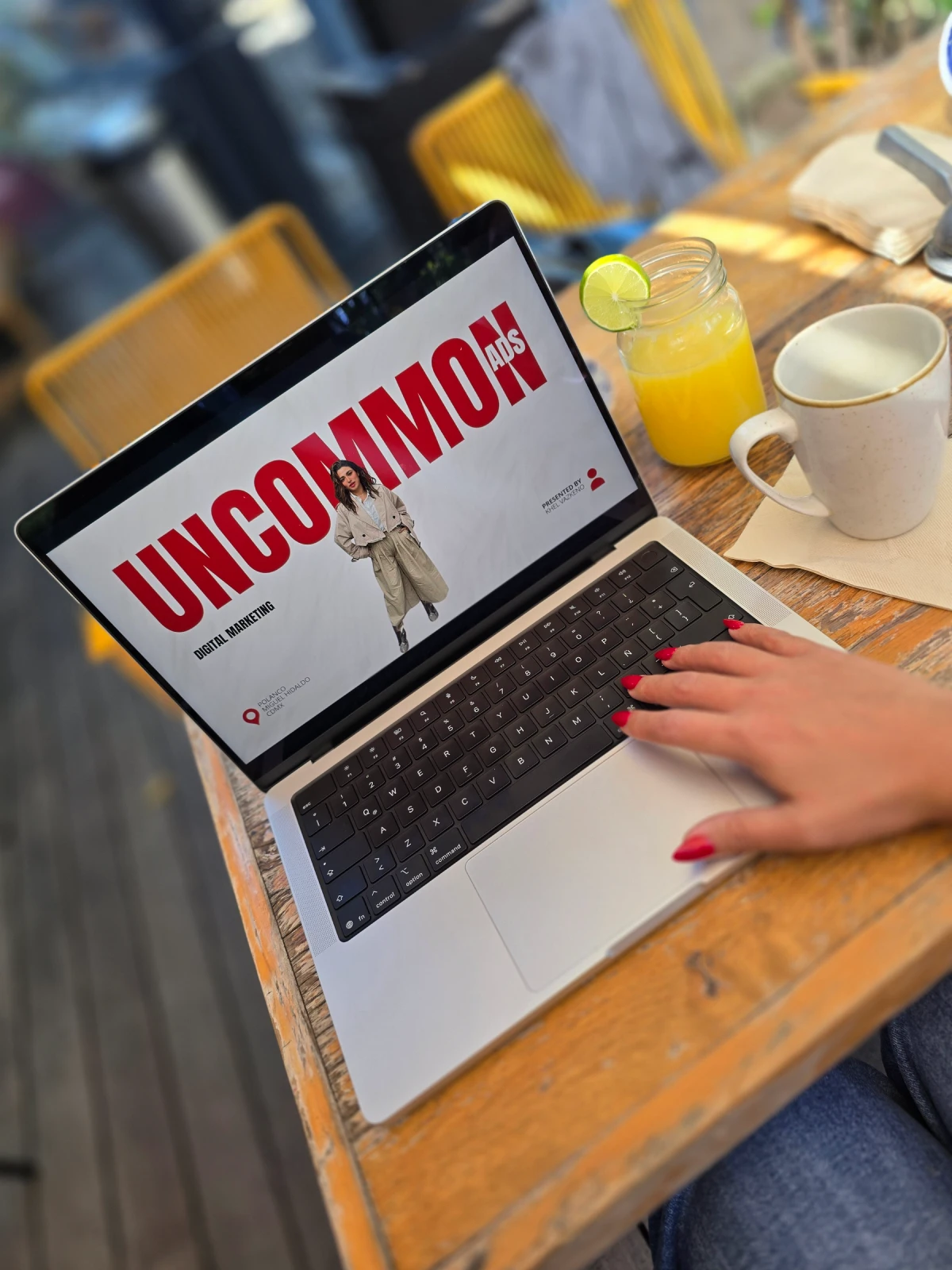 A close-up of a beige-colored laptop with a smooth, matte finish on a matching surface.