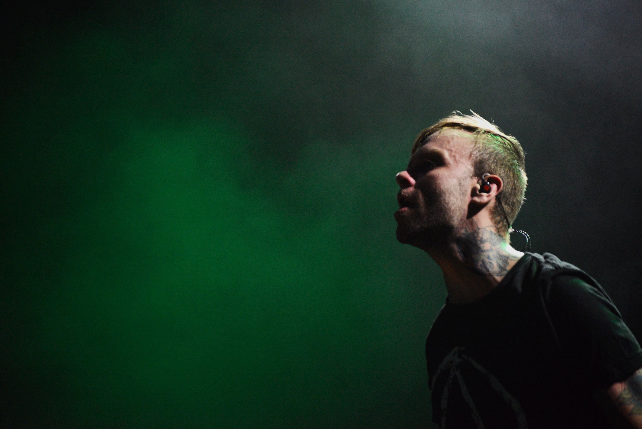 Lead singer of The Used in front og green smoke performing in Bethesda, MD