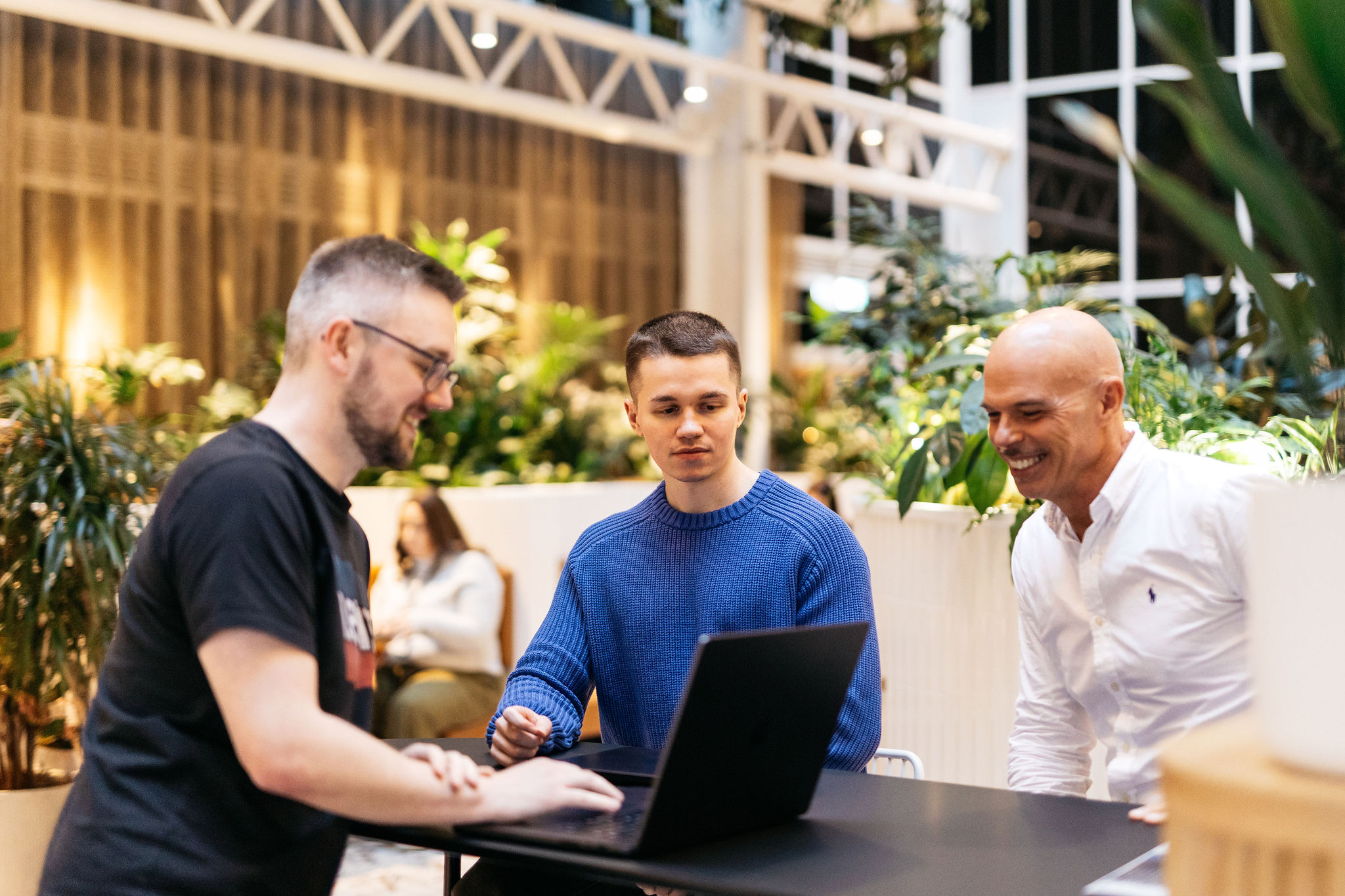Three engineers around a table